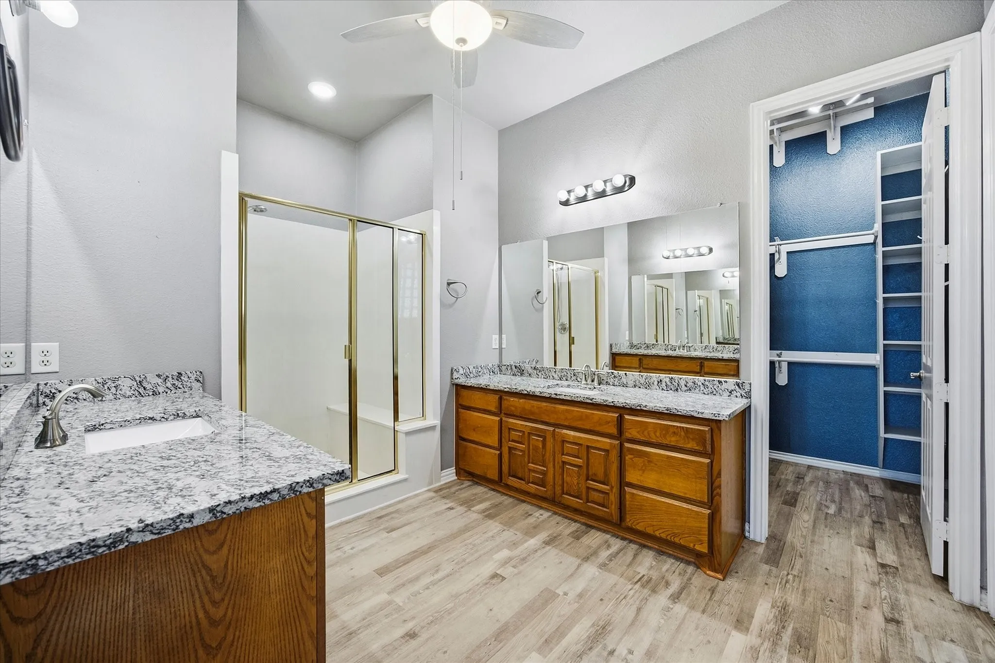 Master bath includes his and her vanities, spa style shower and walk in closet
