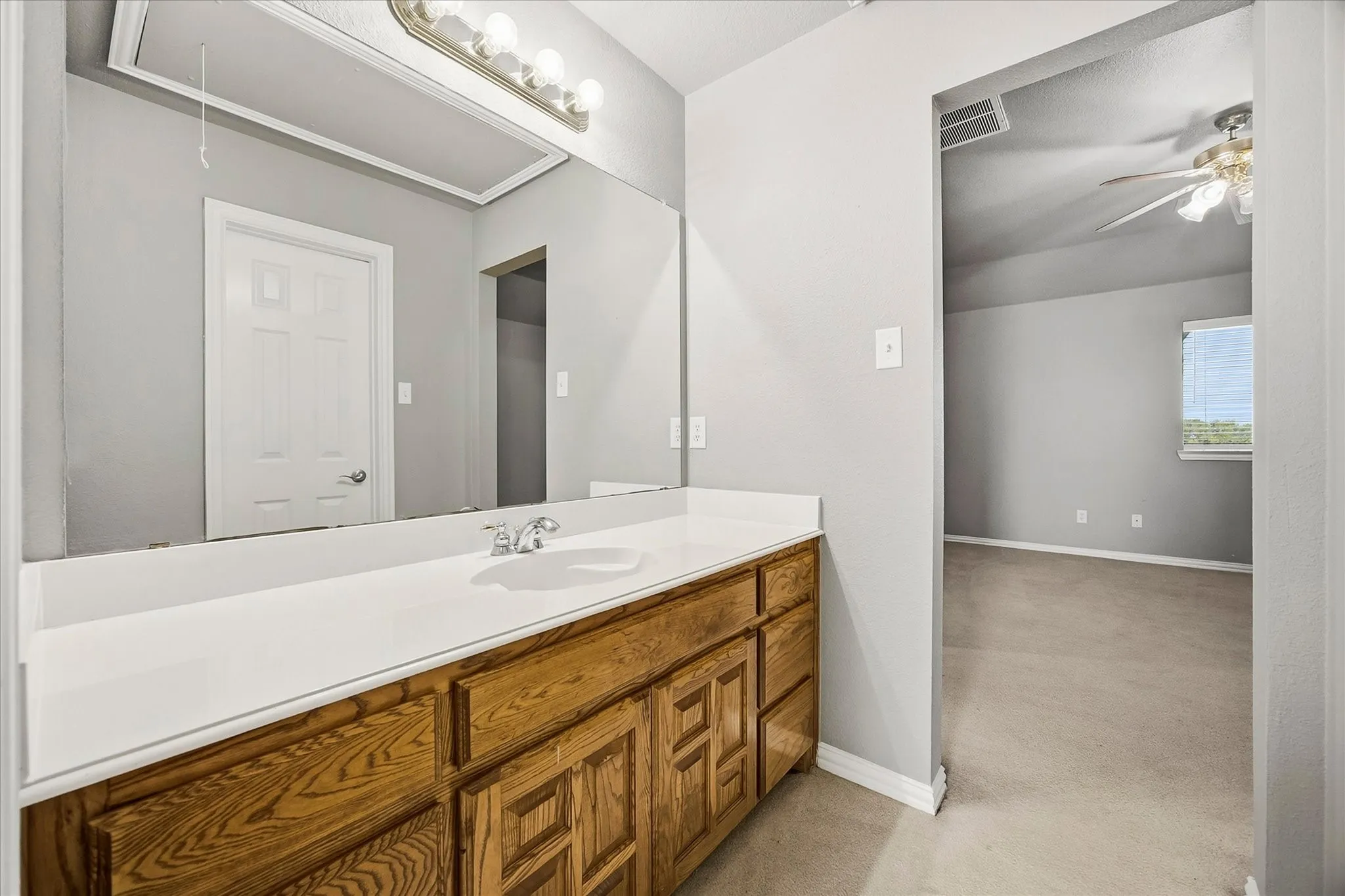 Full bath opens onto bedroom