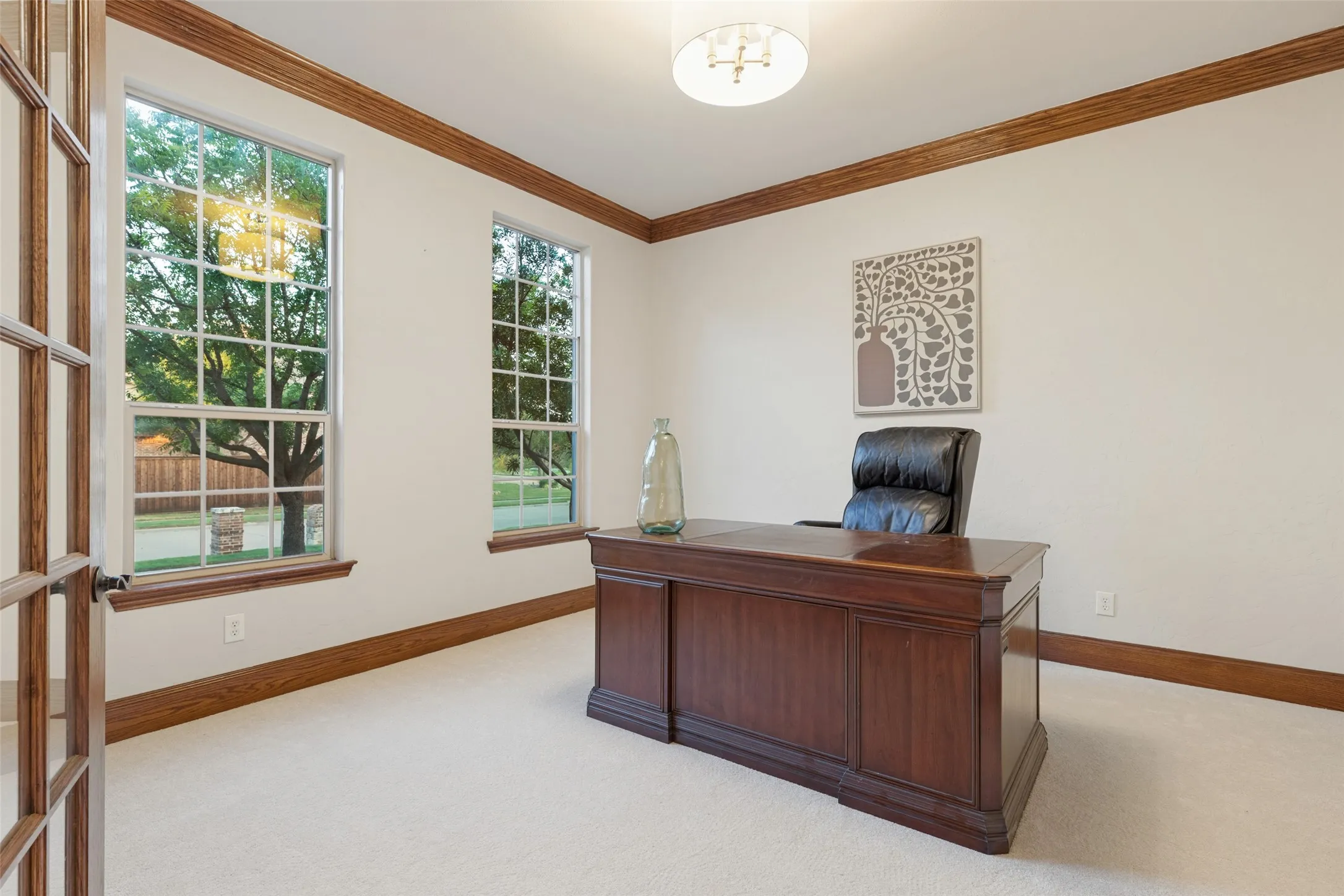 Double French Door and Brand New plush carpet flooring, and crown molding