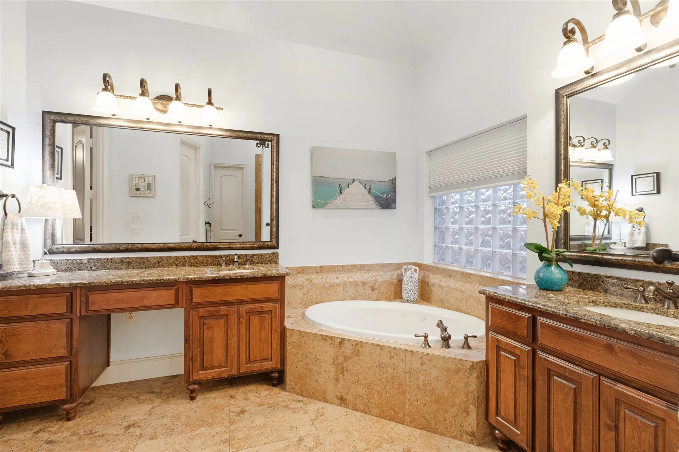 Double vanities and large walk-in shower. and separate tub Closet off bathroom