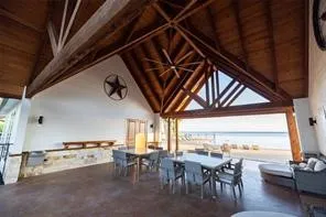 Vaulted wood-paneled ceiling with exposed beams