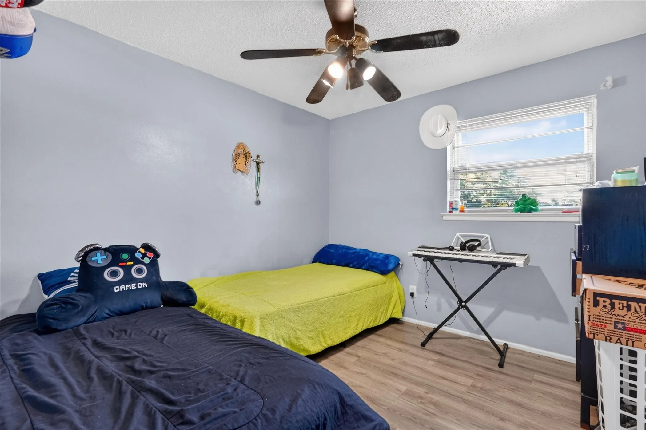 Wood-finish flooring with a light blue wall finish