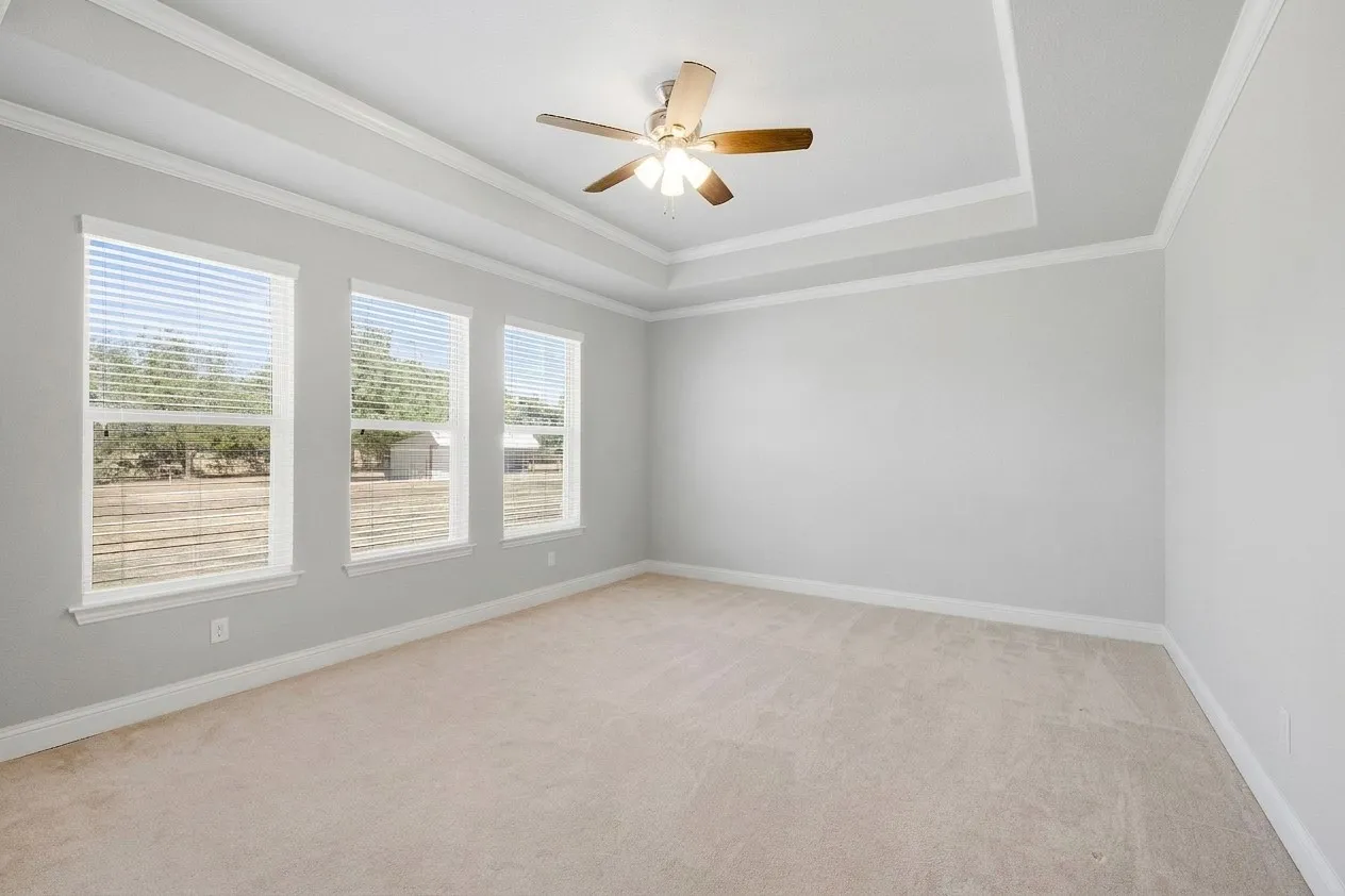 Primary Bedroom tucked toward the rear of the home for privacy - split from all other bedrooms.