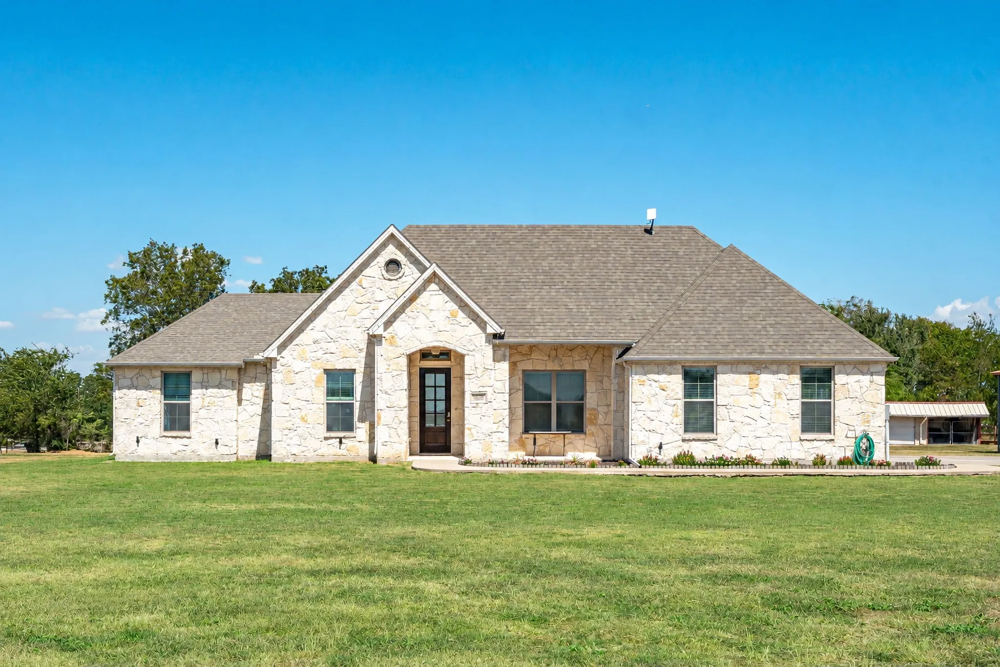 Charming all stone single story home on an 1.5 acres!