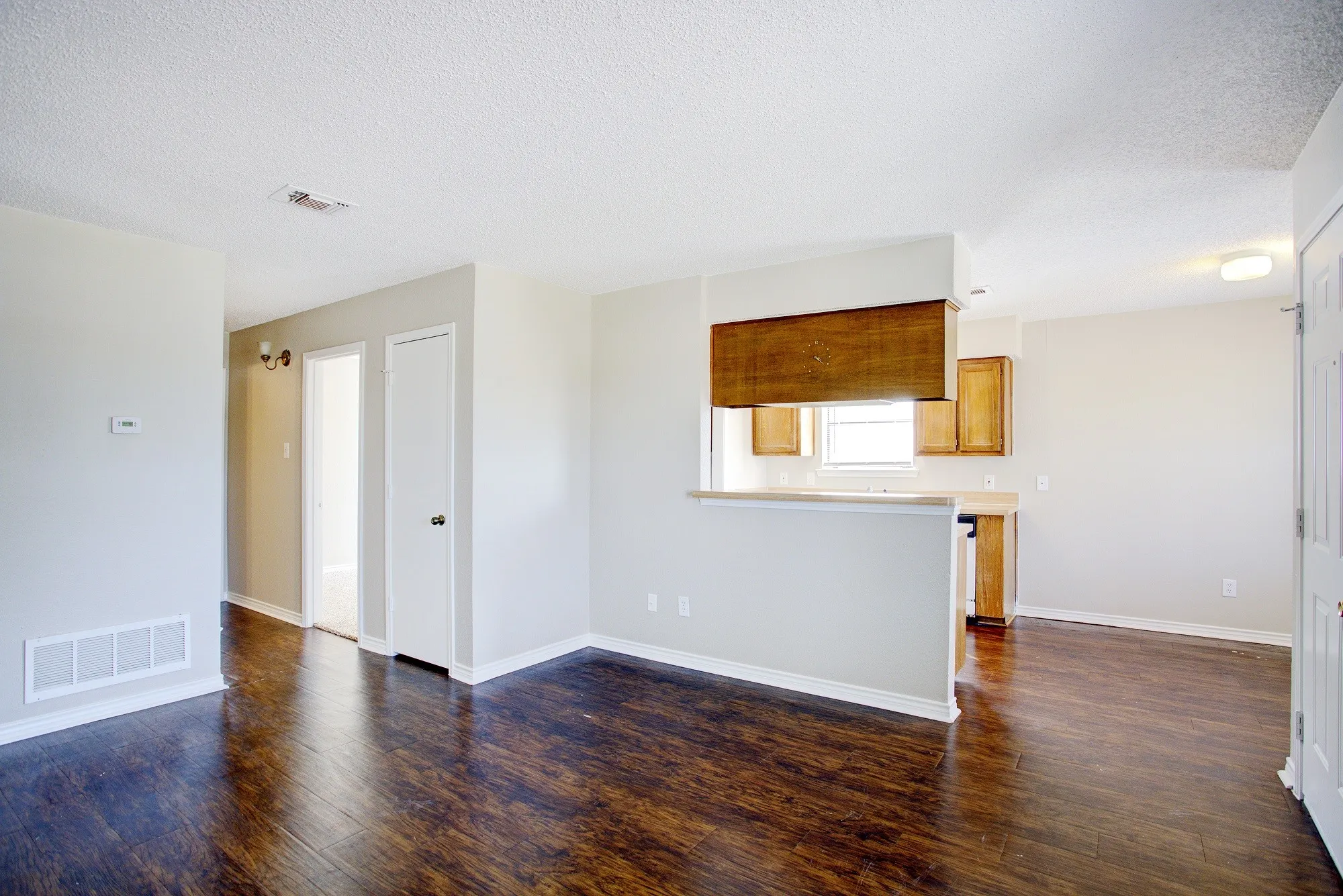 Wood-finish flooring throughout the main living areas