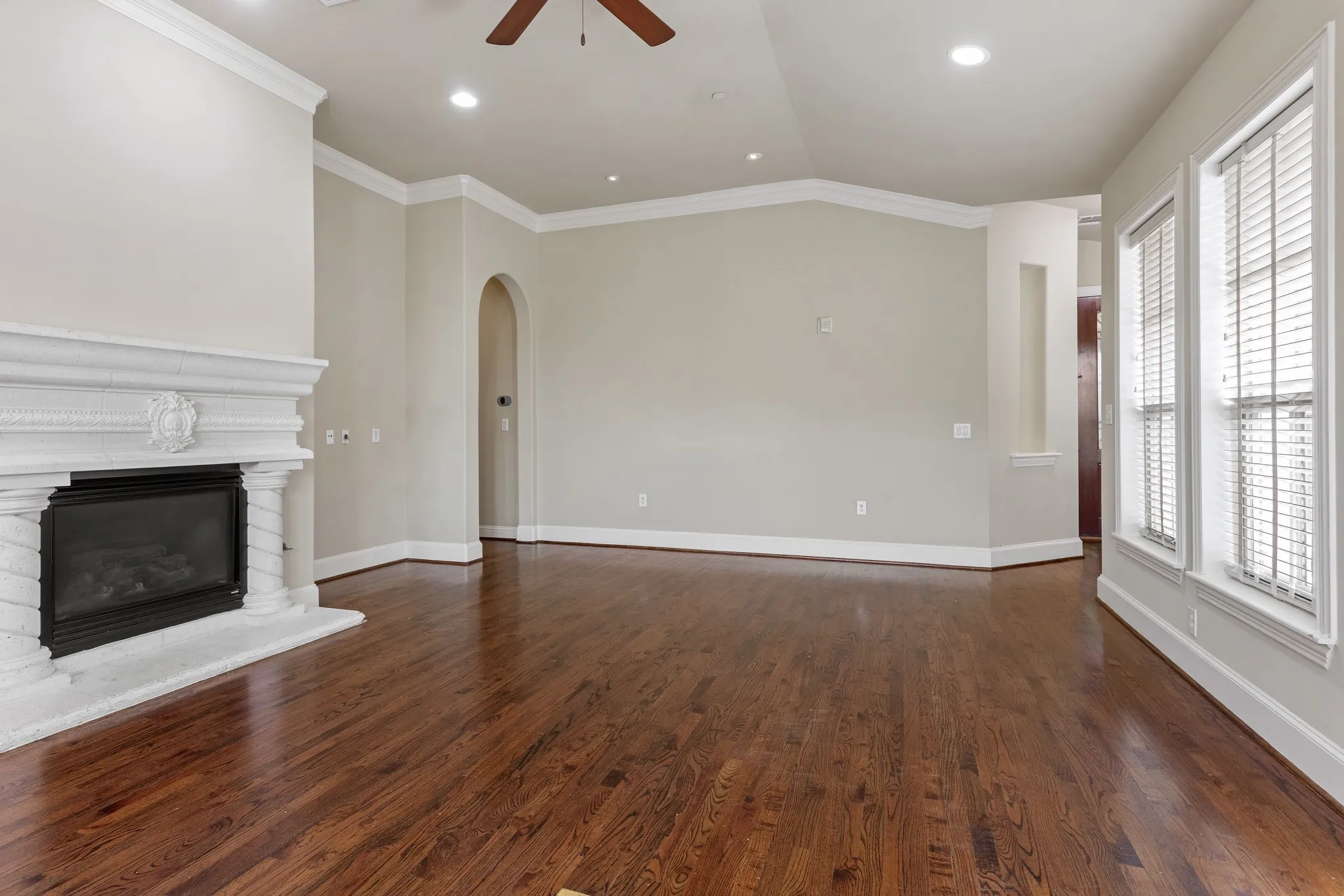 Living area with gas fireplace and ceiling fan