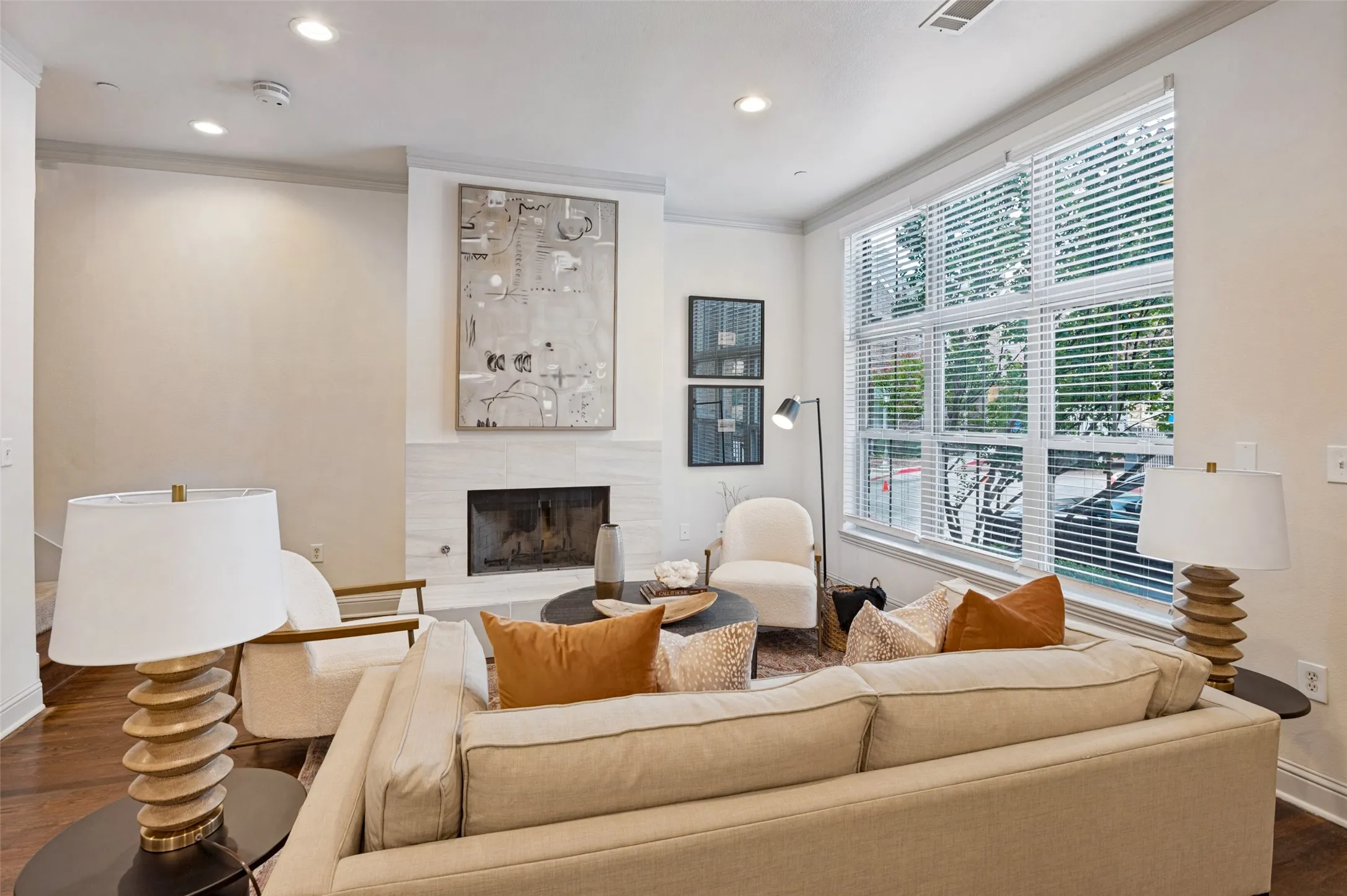 Living room with fireplace and an abundance of light