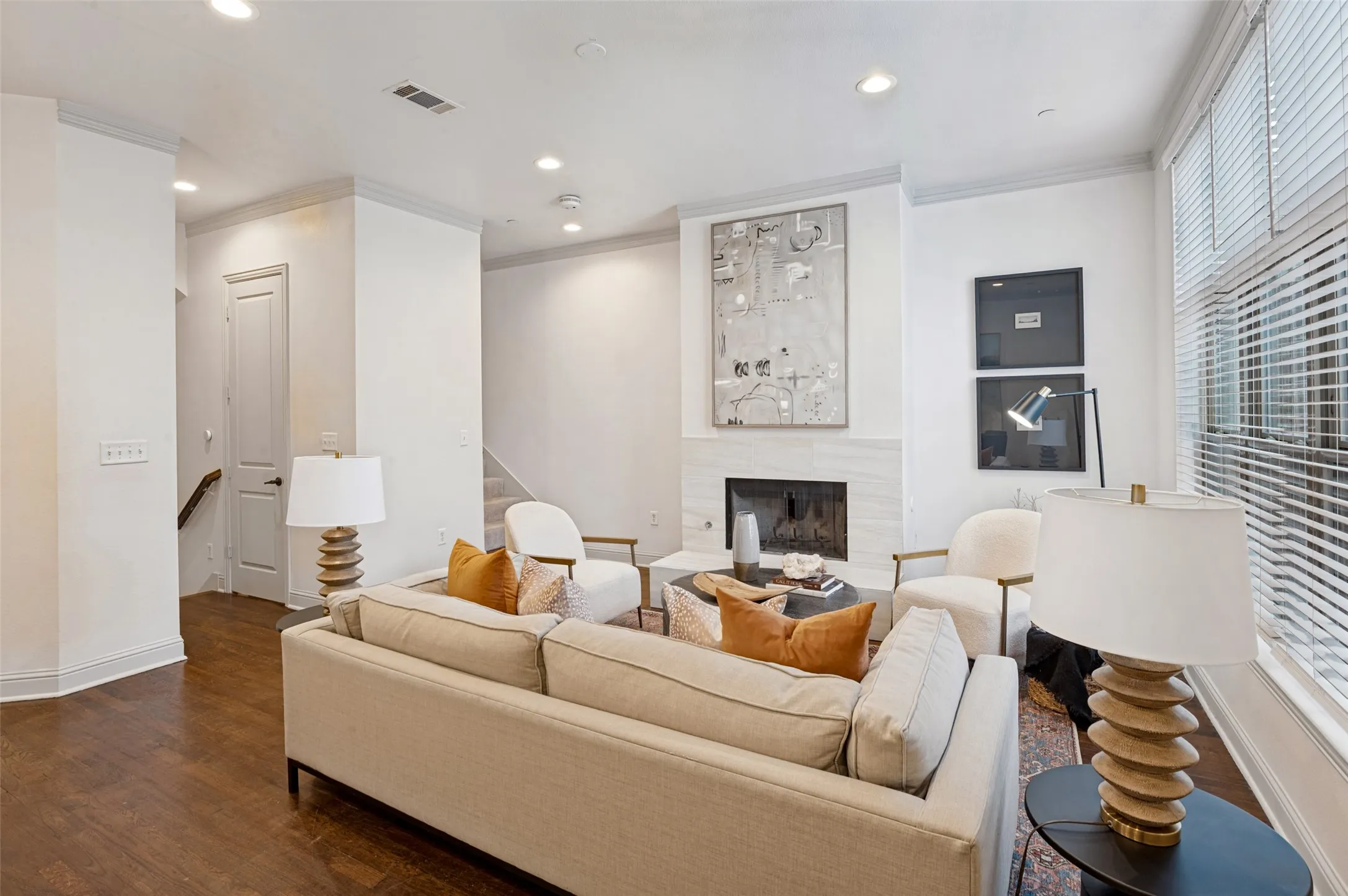 Living room with stairway down  to attached oversized 2 car garage