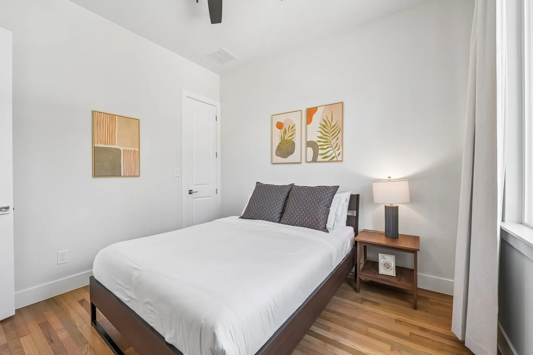 Hardwood flooring, recessed lighting, ceiling fan, white paneled doors, and white trim