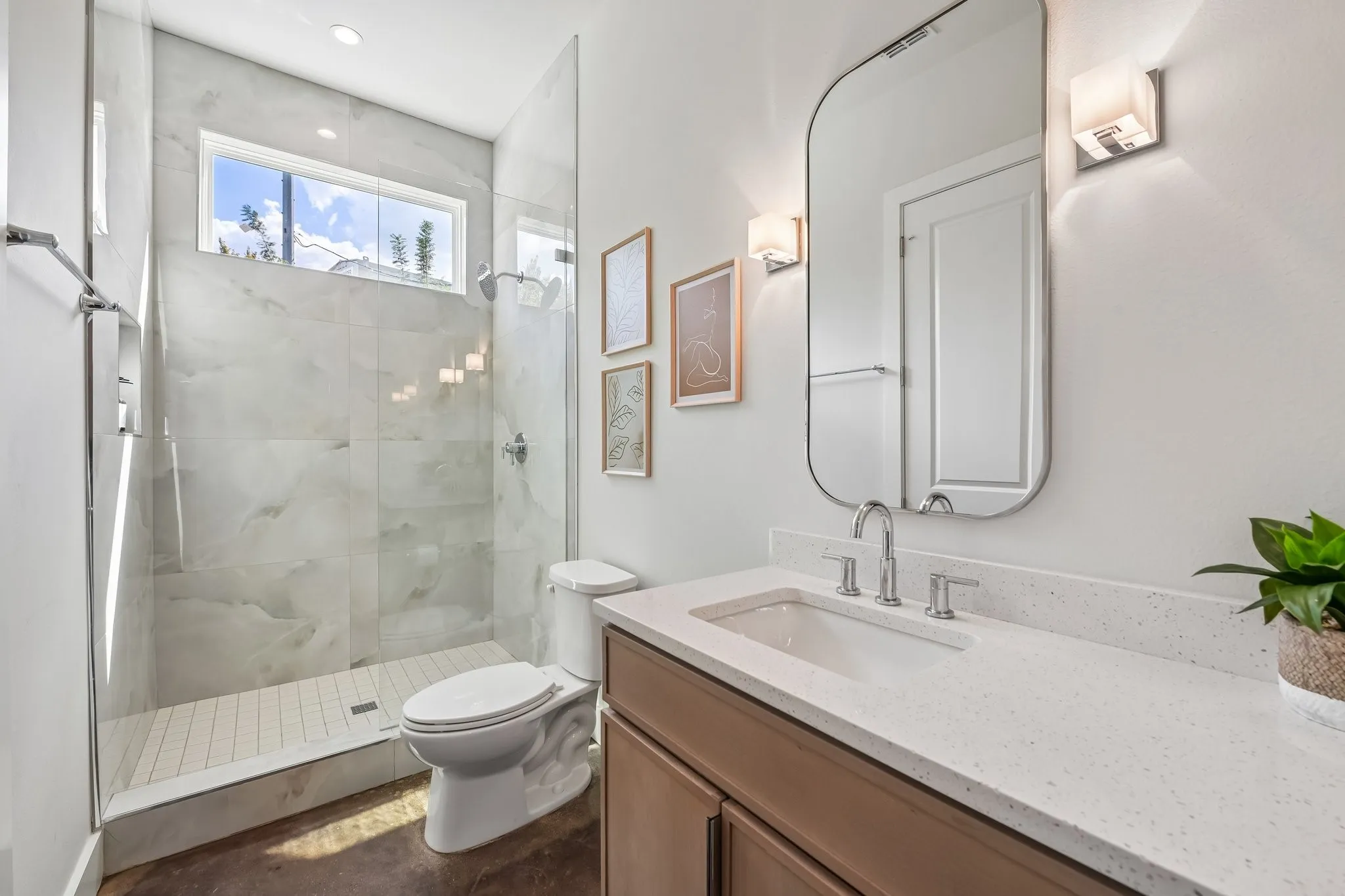 Walk-in shower with full-height tile surround and glass enclosure
