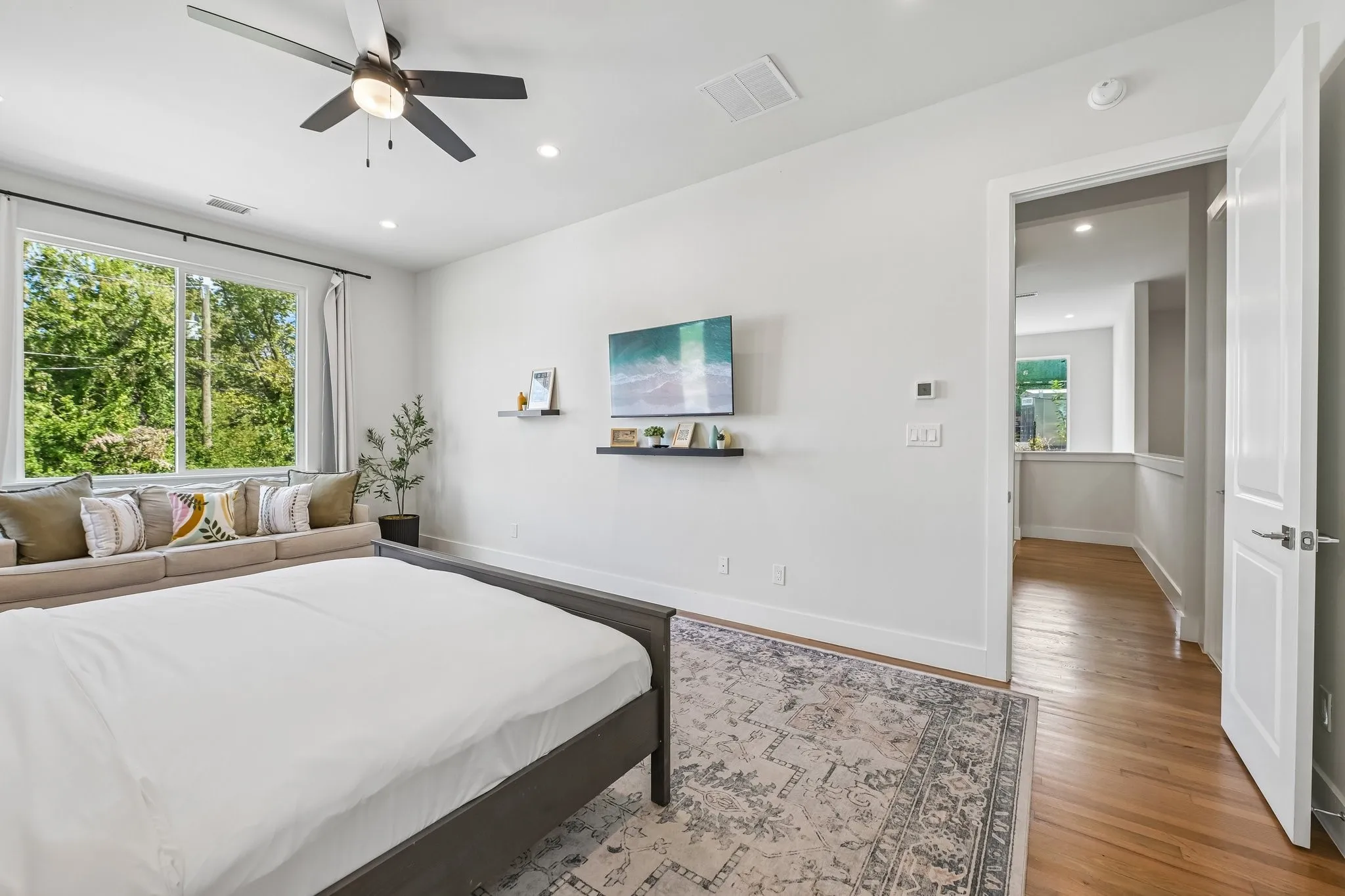 Hardwood flooring, recessed lighting, and a ceiling fan with integrated lighting