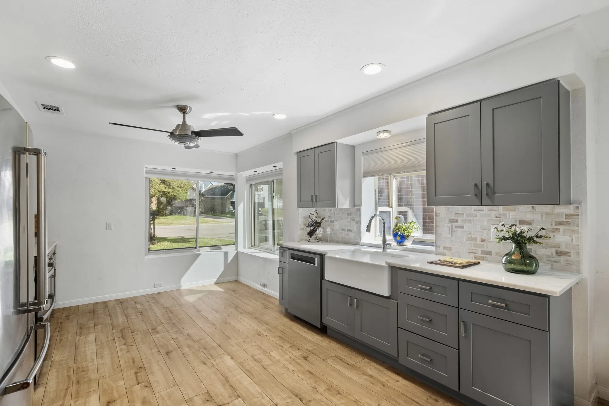 Apron Front Sink with Shaker Style Cabinetry with soft pull Drawers