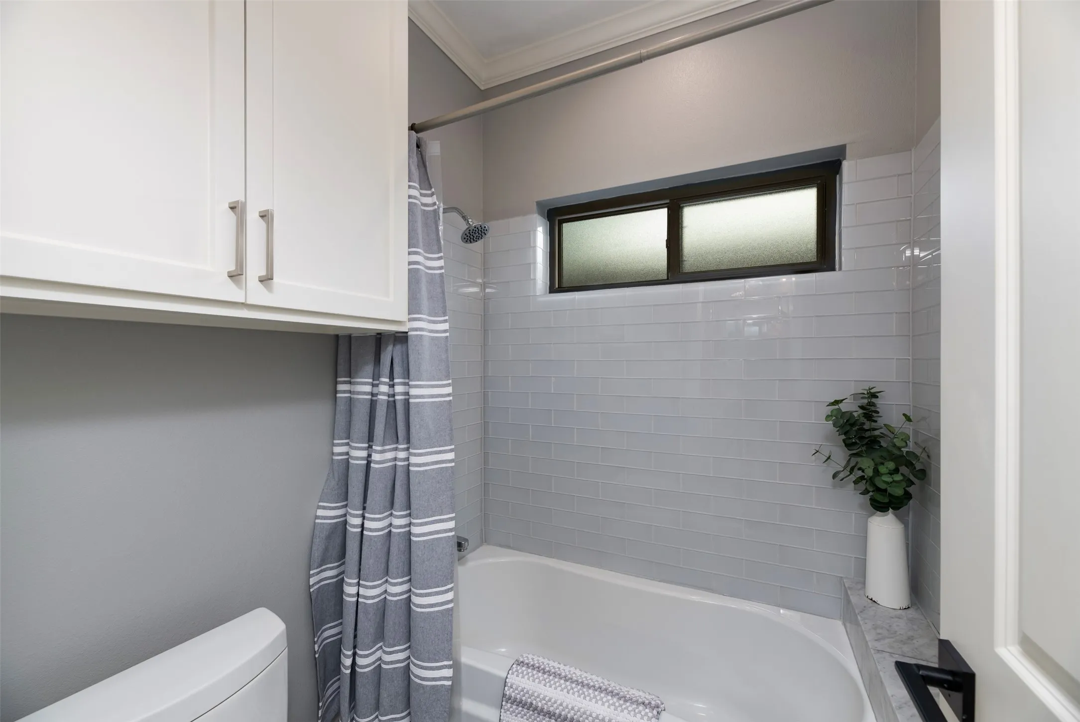 White shaker-style cabinetry with brushed nickel hardware