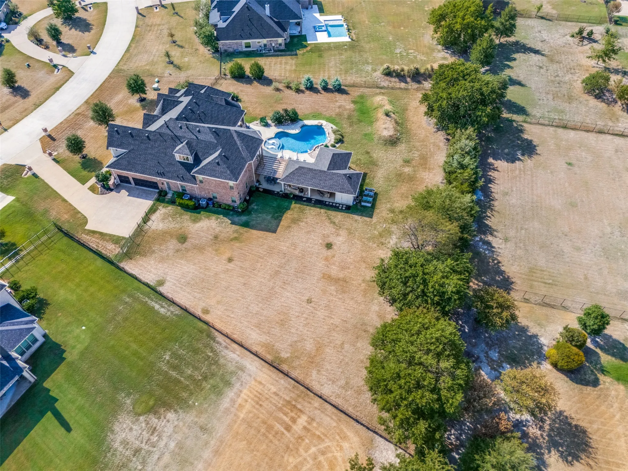 Driveway to 3 car garage & grassy side yard