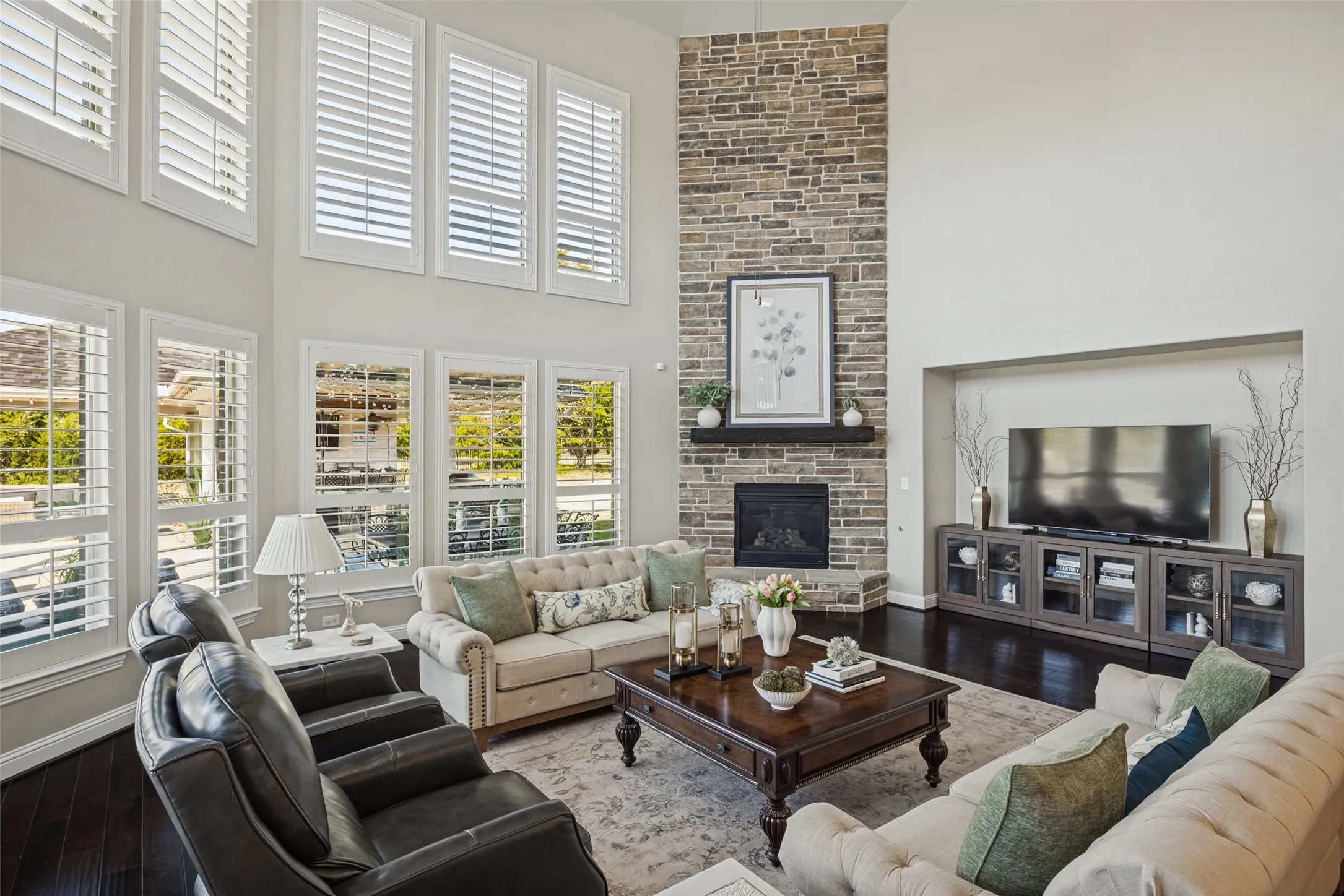 Family room with 2 story windows & fireplace