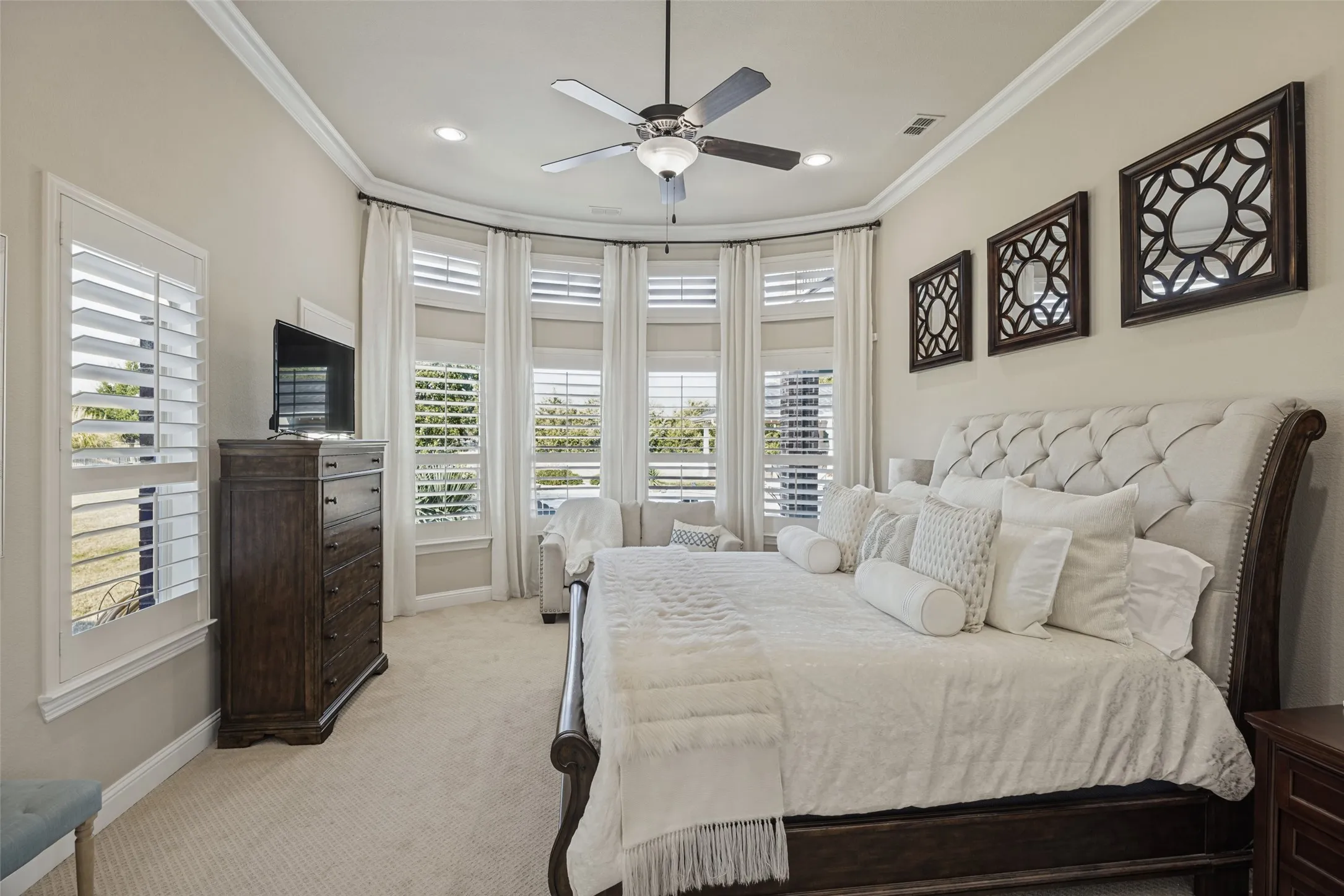 Primary bedroom enjoys views of back yard