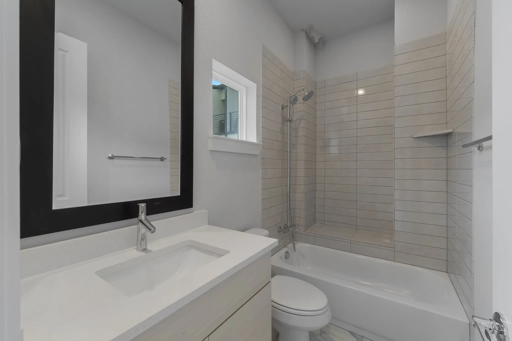 Full bathroom featuring toilet, vanity, and shower / bath combination