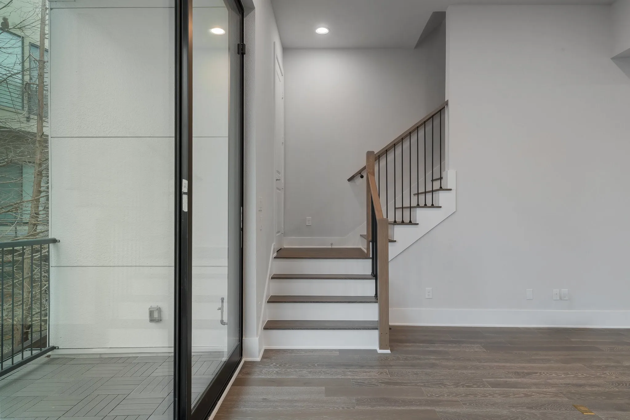 Stairs featuring recessed lighting, wood finished floors, and baseboards