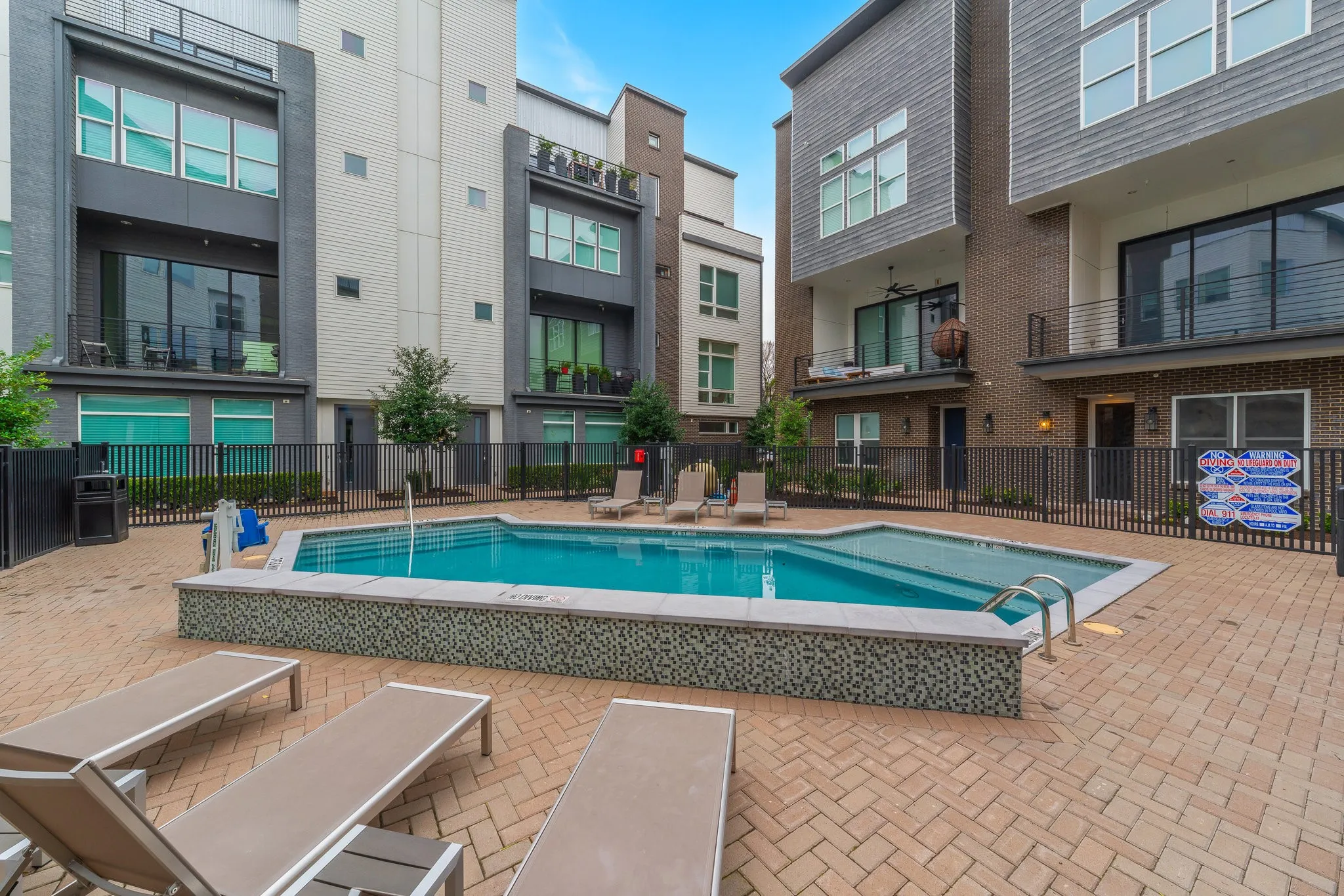 View of swimming pool featuring fence