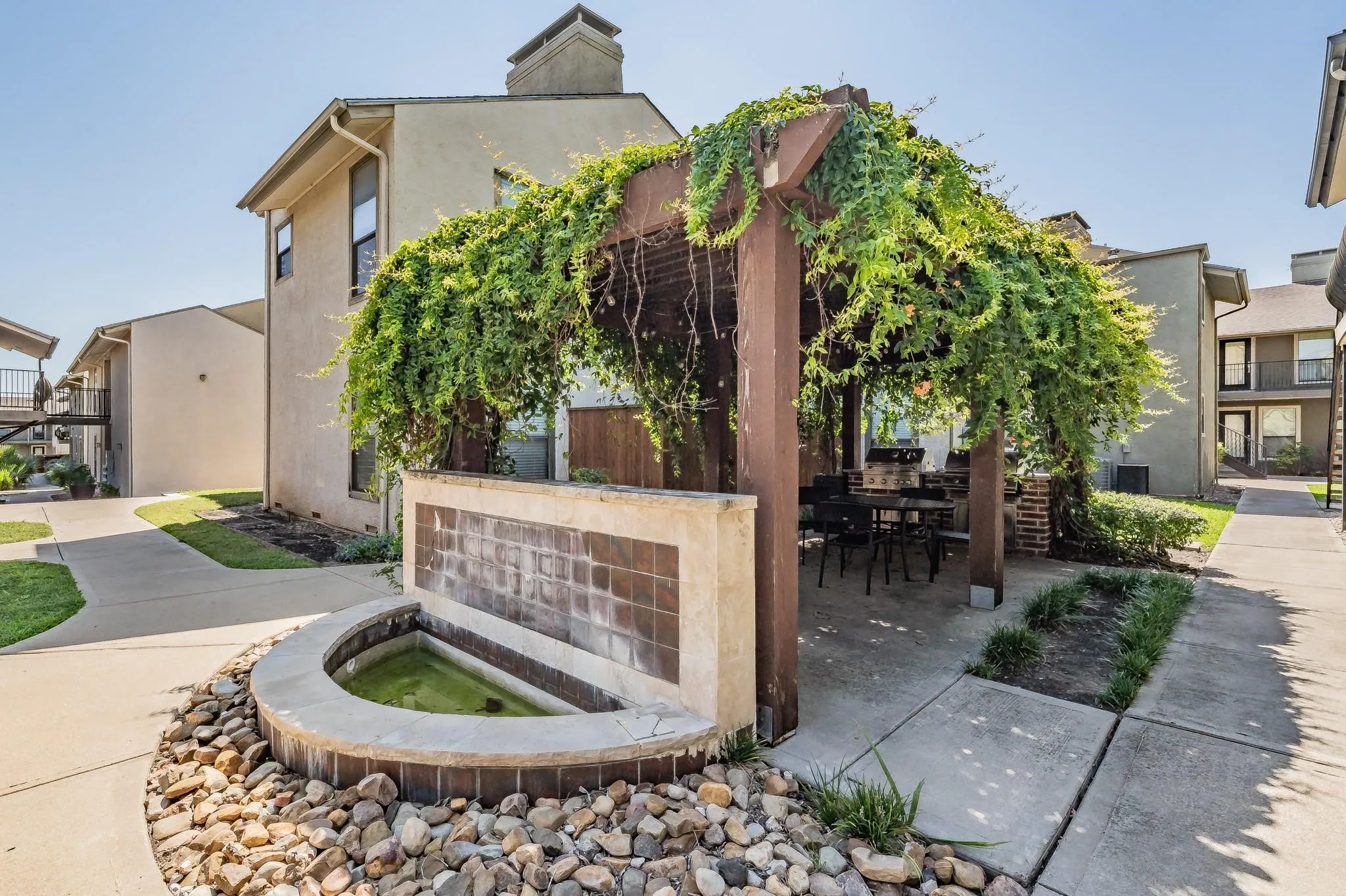 Outdoor pergola with lush climbing foliage