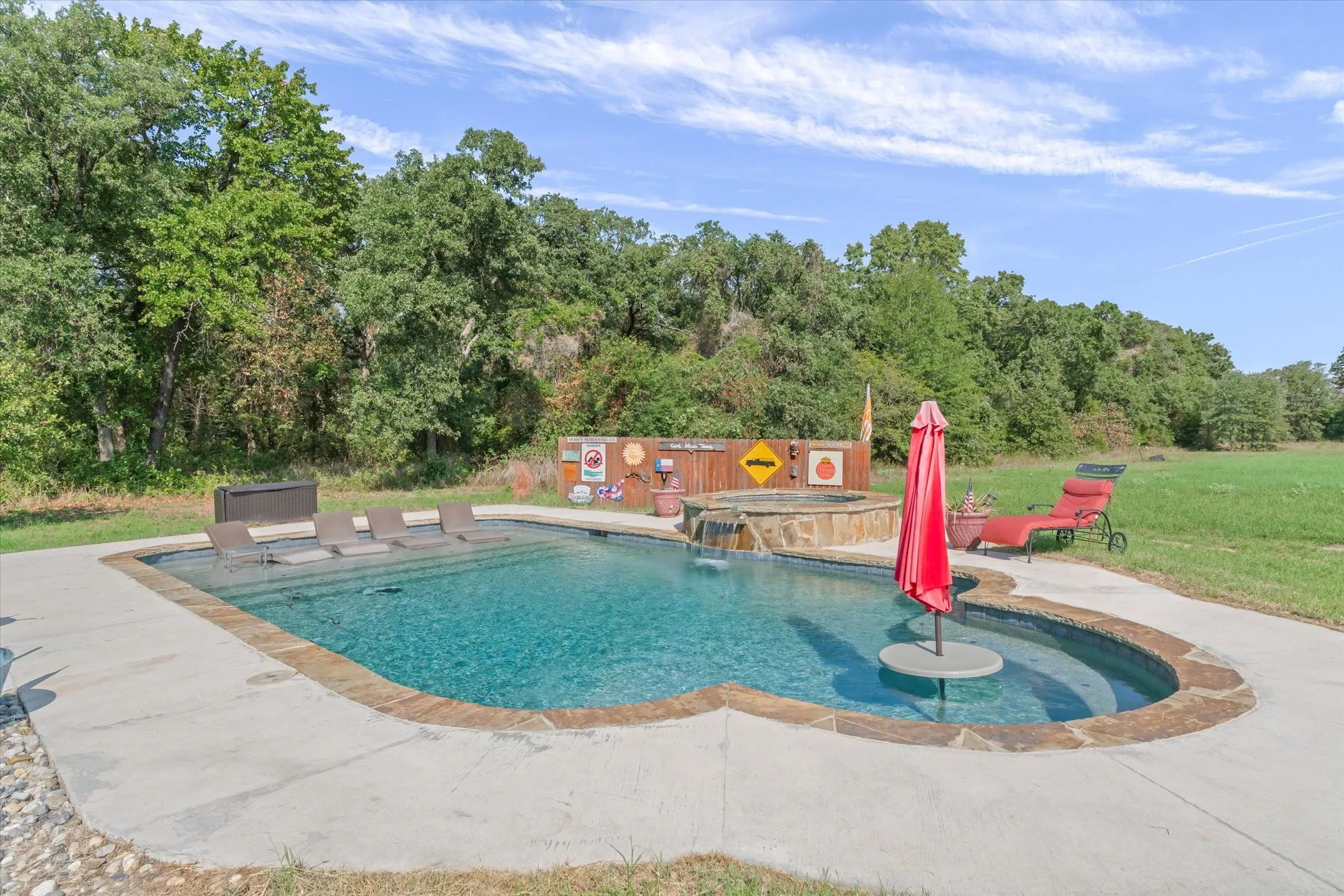Chlorine Gunite pool with a hot tub