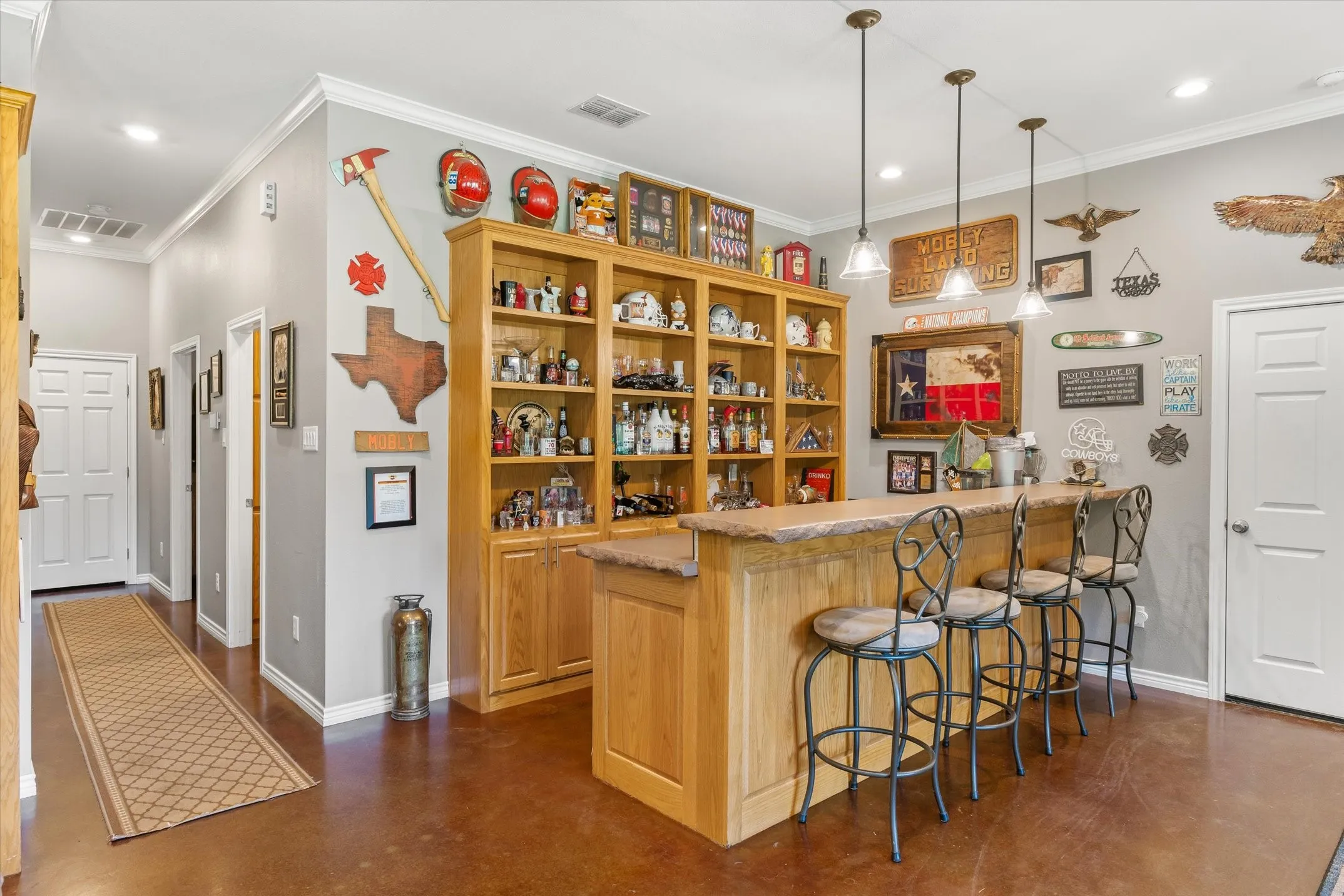 Floor to ceiling cabinets on this custom wood bar