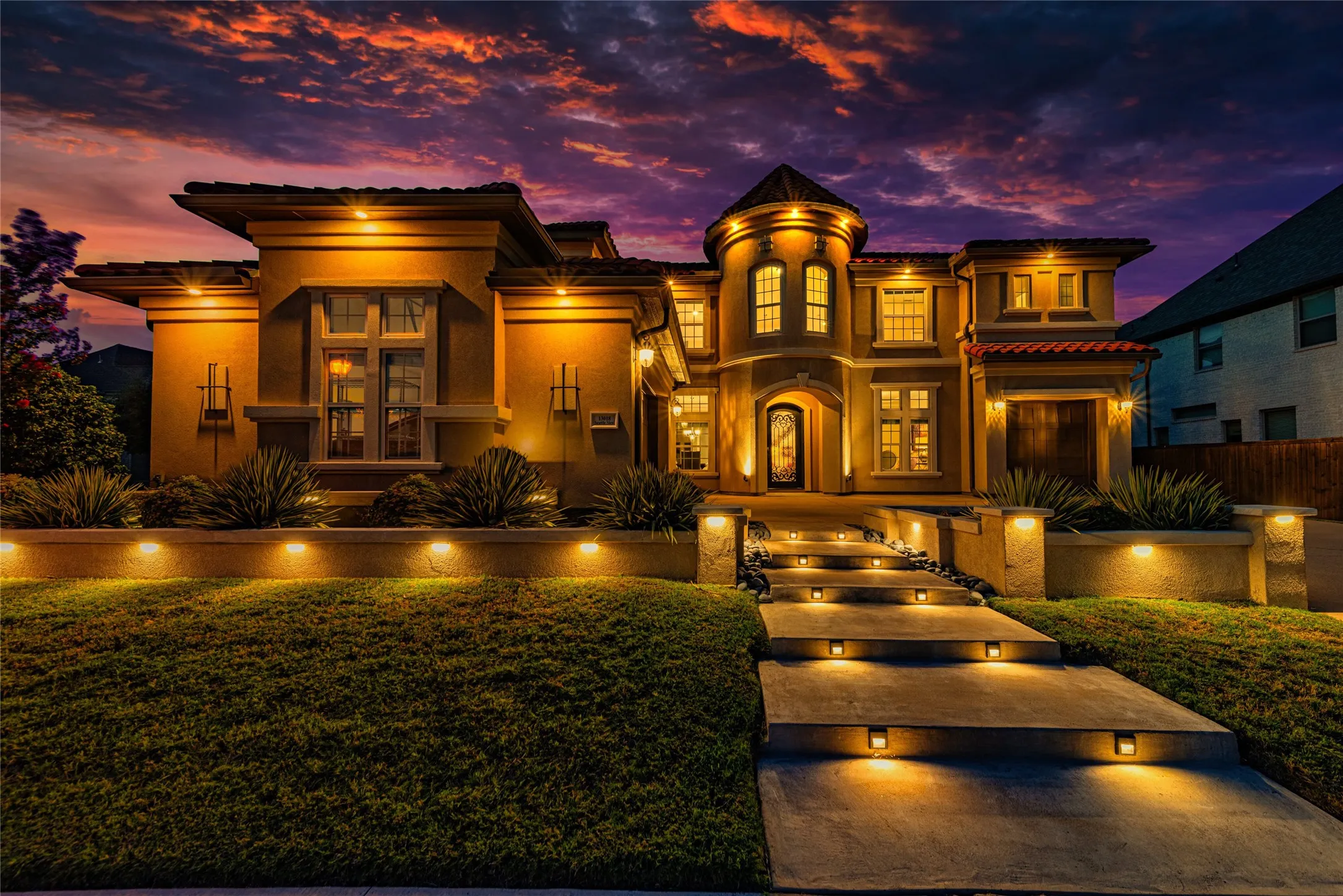 Stucco exterior with multiple architectural elements, including a round turret, Spanish tilted roof