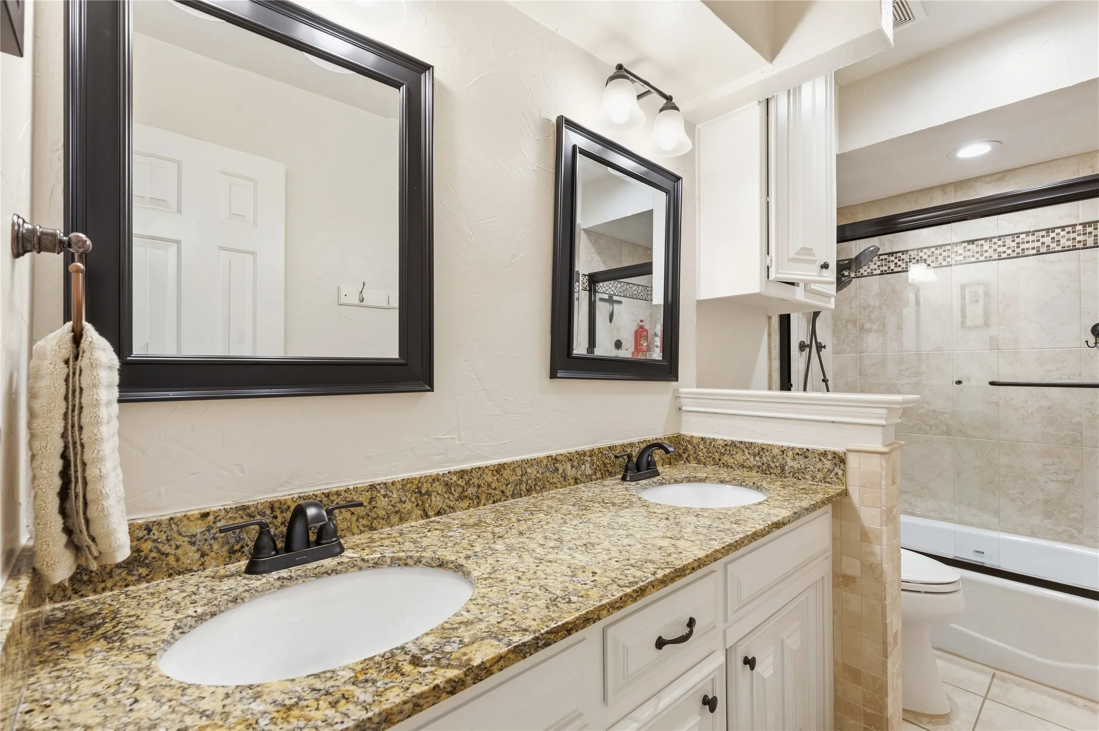 Double vanity with granite countertop and undermount sinks