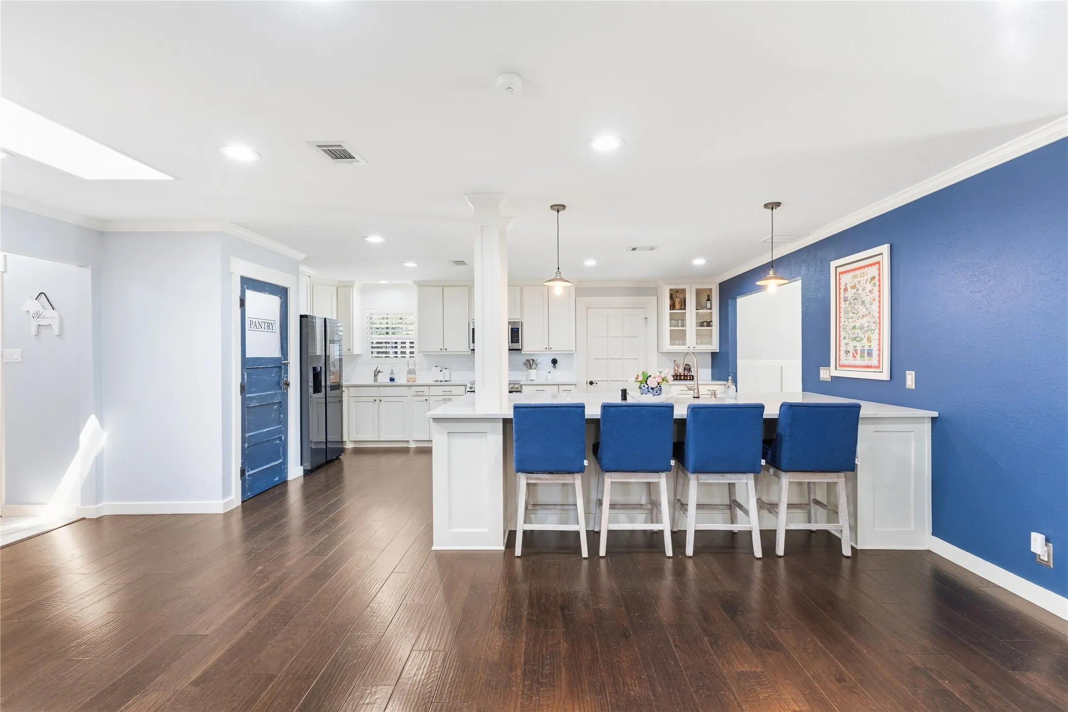 Wood-finish flooring throughout, with a skylight and recessed lighting