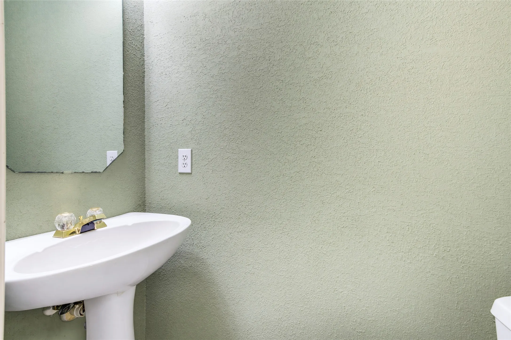 1/2 bath off the hallway between the kitchen and dining rooms....