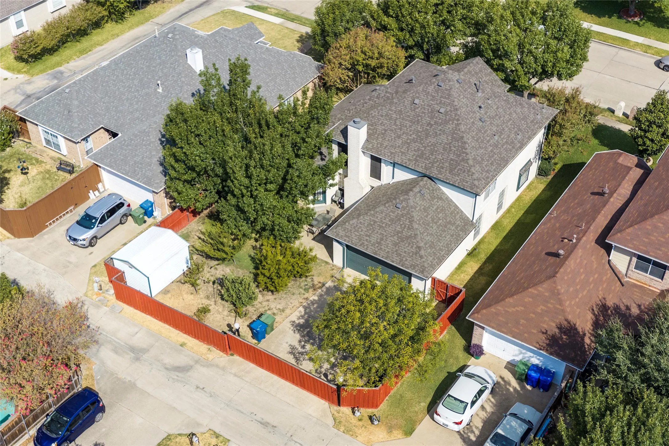 Two-story residence with attached garage and a fenced backyard with electric wooded gate.....