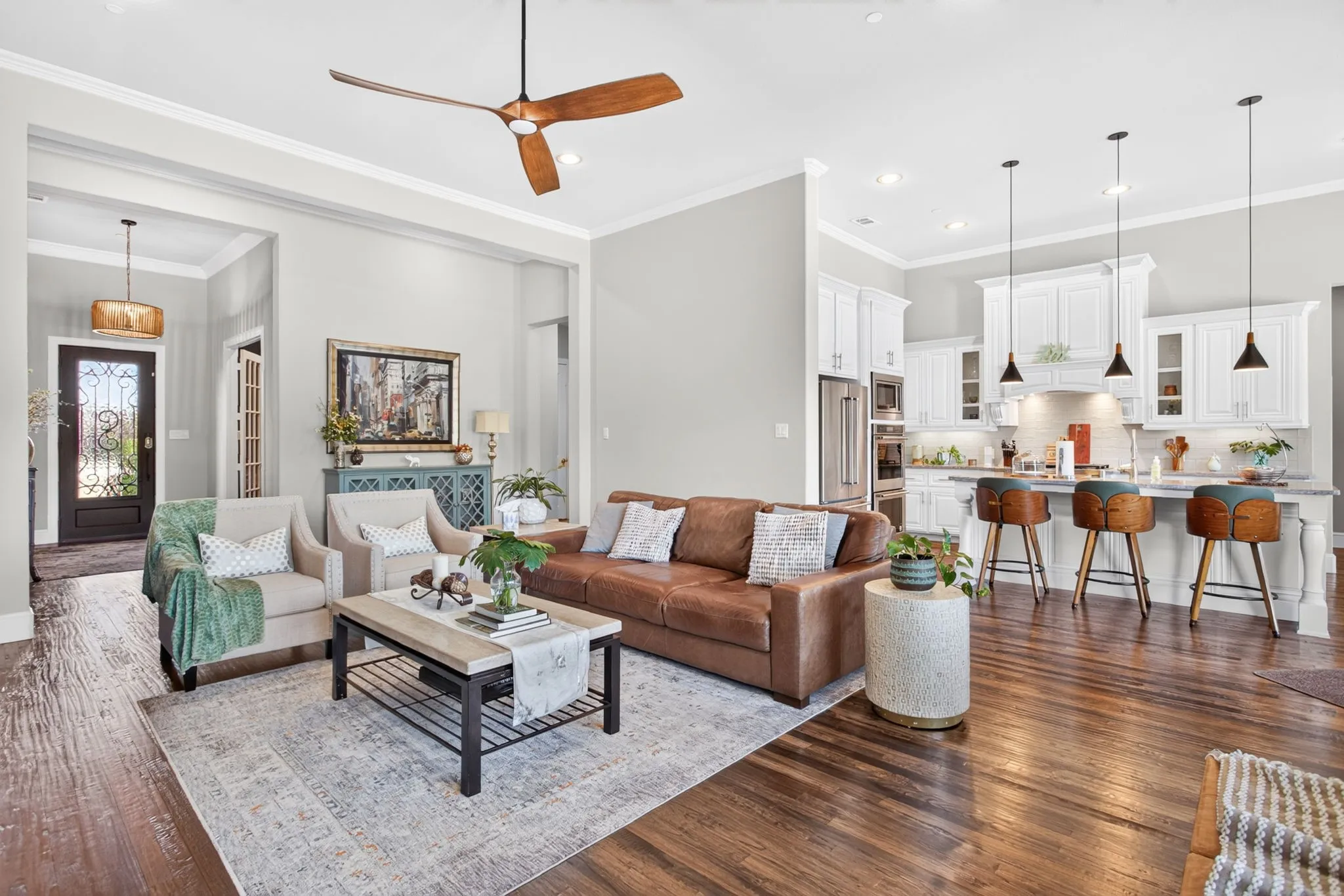 Wood-finish flooring throughout, with a spacious open-concept design