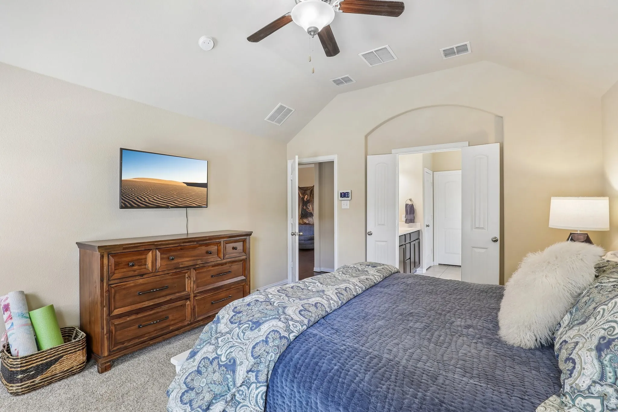 Primary suite with double-door entry to en-suite bath.