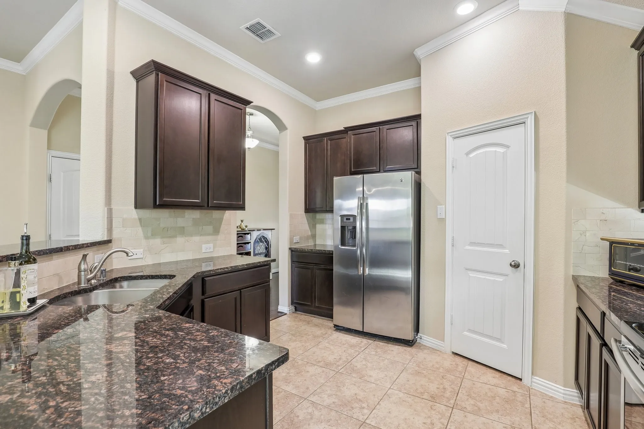 Kitchen with pantry and entry from hallway.