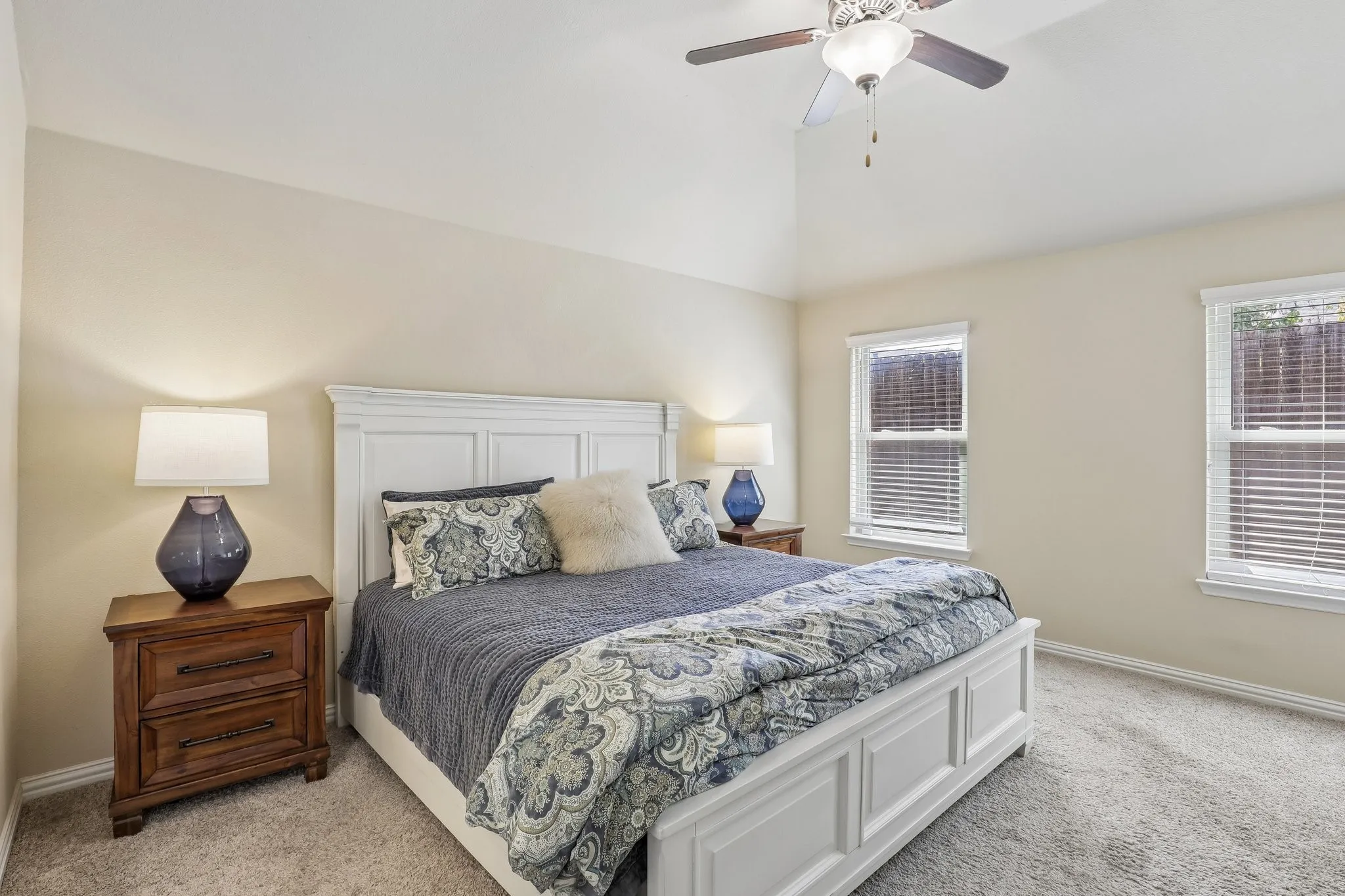 Primary suite with vaulted ceiling.