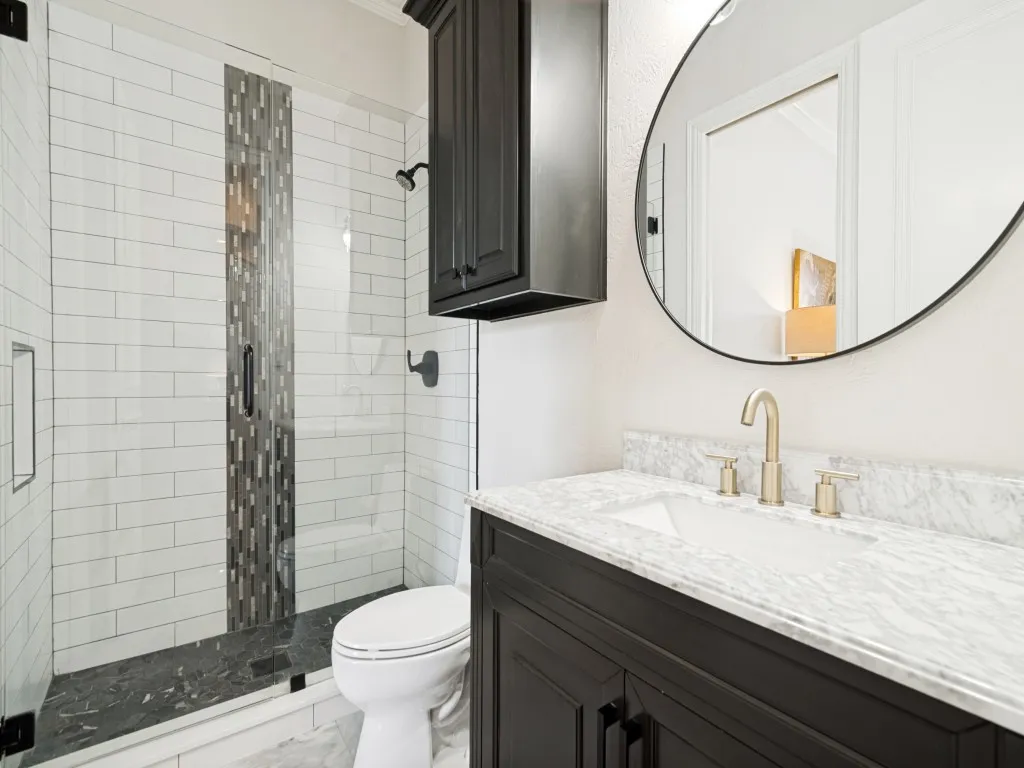 Ensuite bath to the downstairs bedroom is also accessible through a hall entry.
