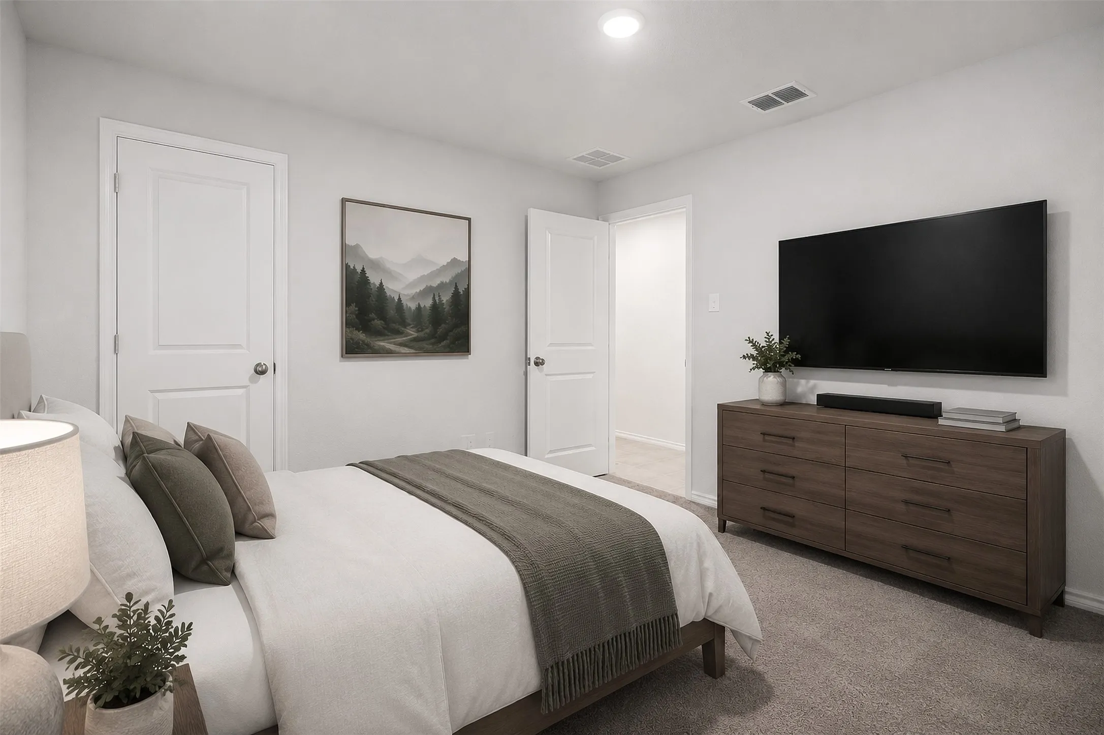 Plush carpeting, recessed ceiling lighting, and crisp white trim