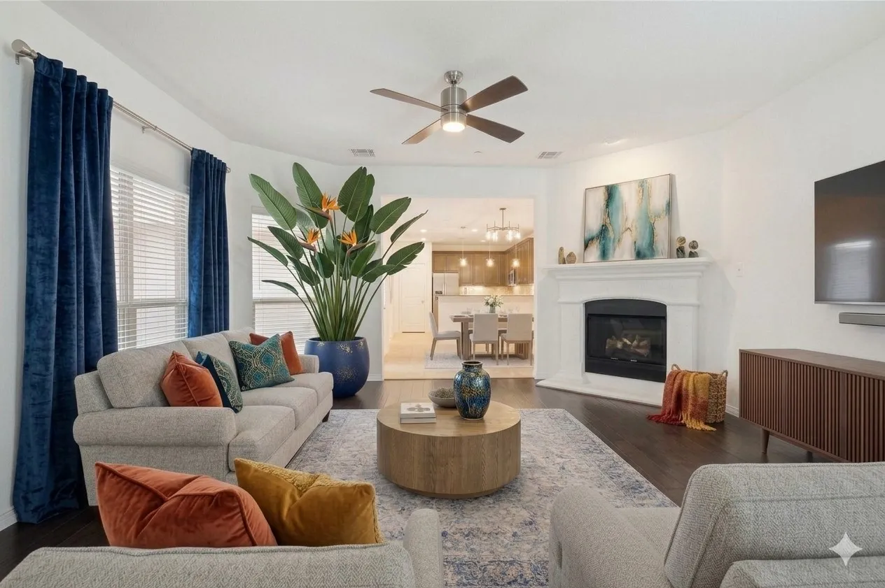 Recessed lighting, dark wood-finish flooring, and a ceiling fan with integrated lighting
