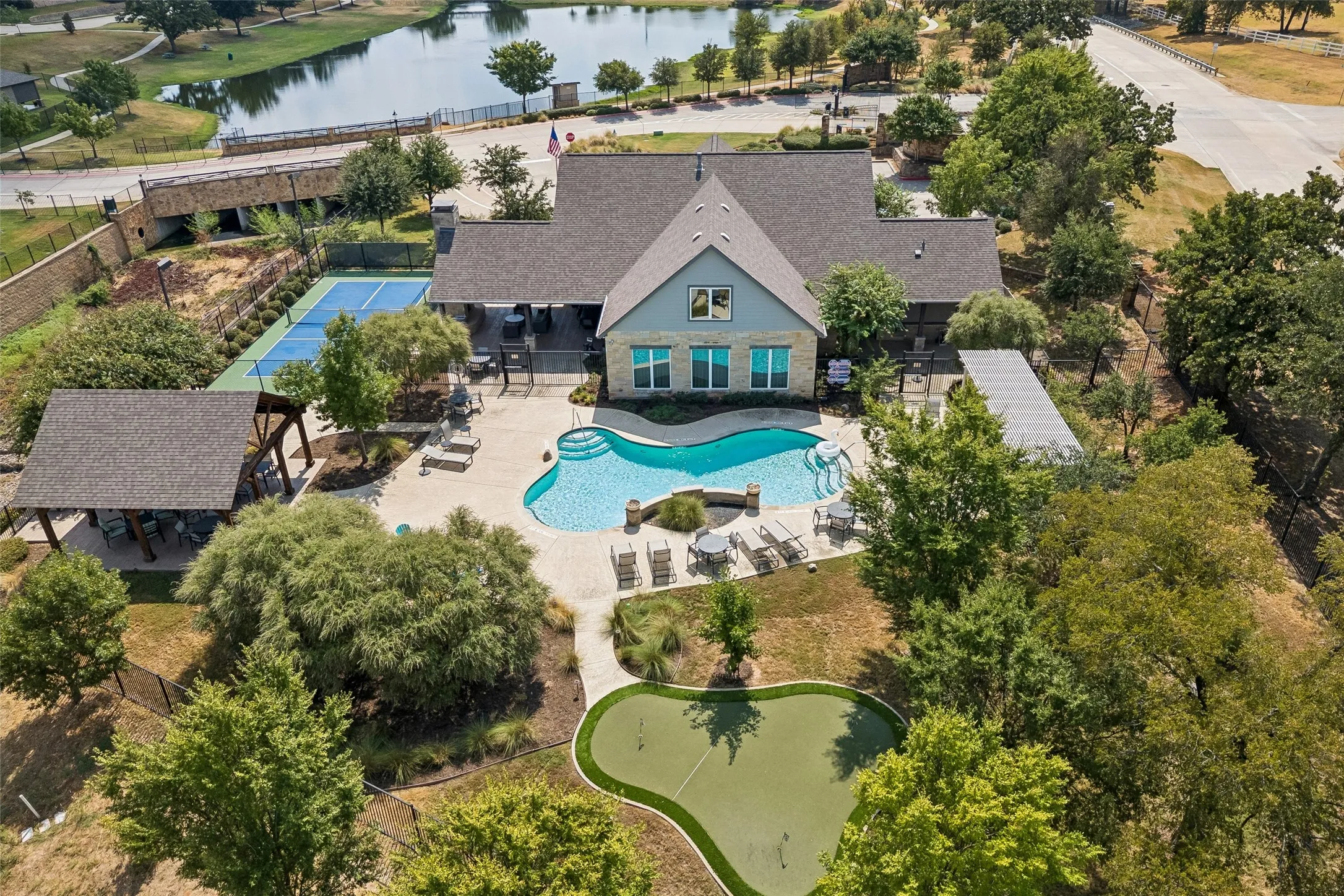 Community Center with pickle ball court, pool, putting green and clubhouse.