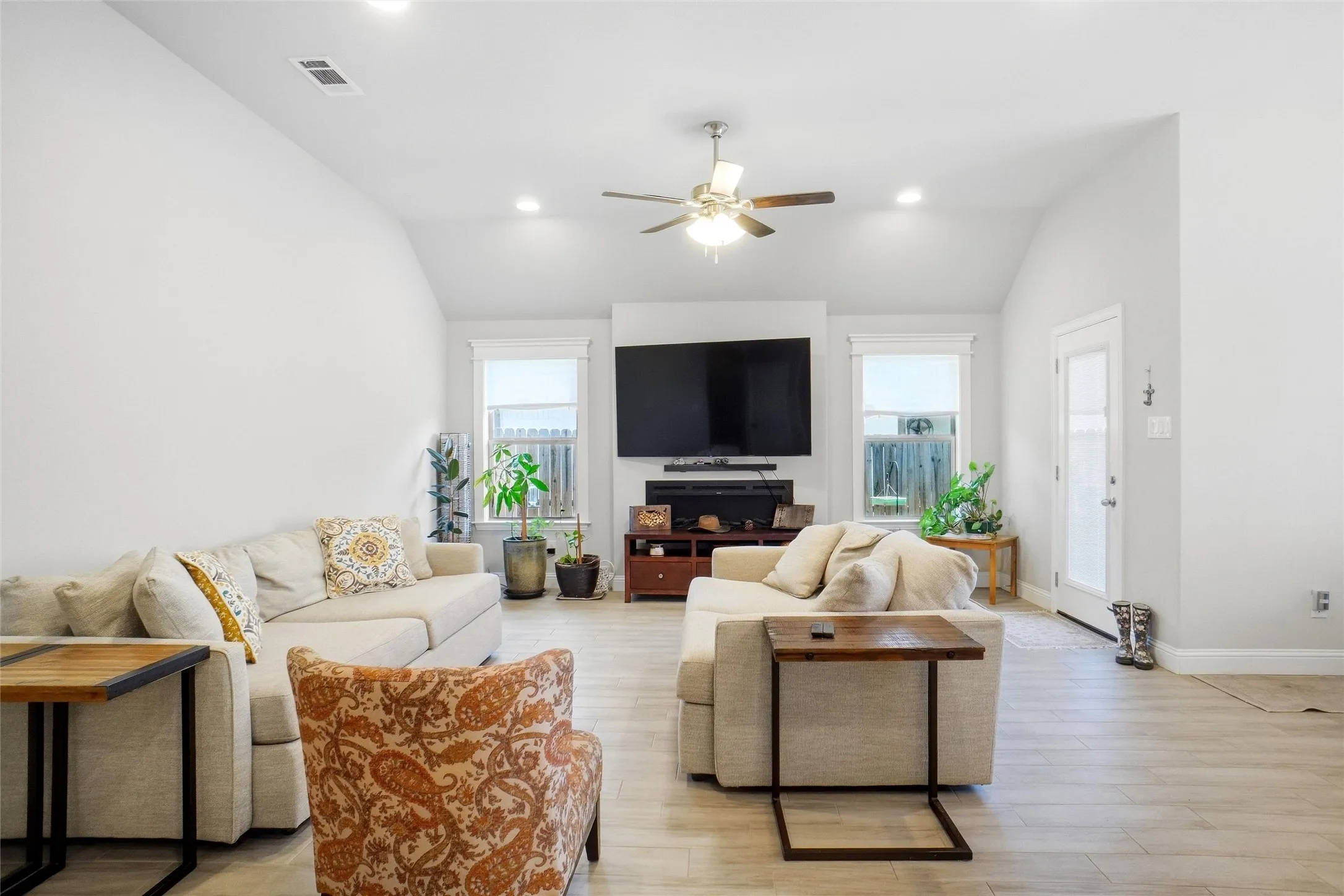 View of Living Area with Electric Fireplace from Kitchen Island
