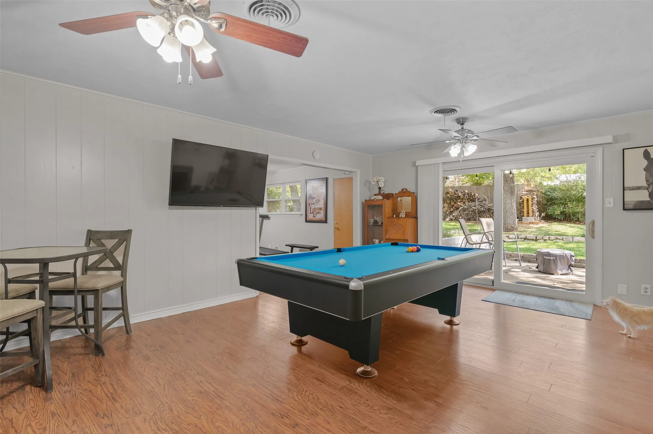 Enjoy sweeping views out to the greenery of the large backyard with mature shade trees.