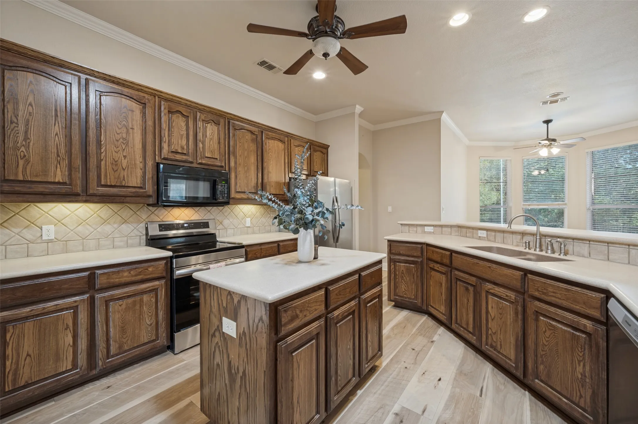 The kitchen looks out to the pool, breakfast nook and living room and truly is the heart of the home