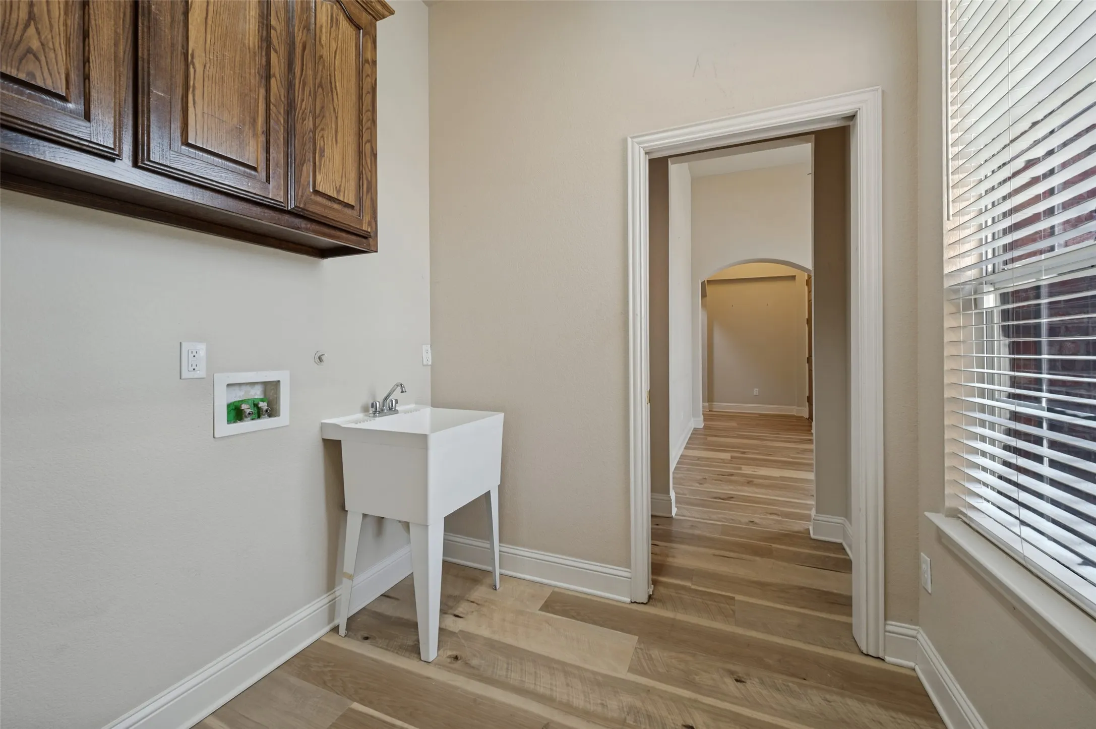 The laundry is oversized for storage and also features a wash basin!