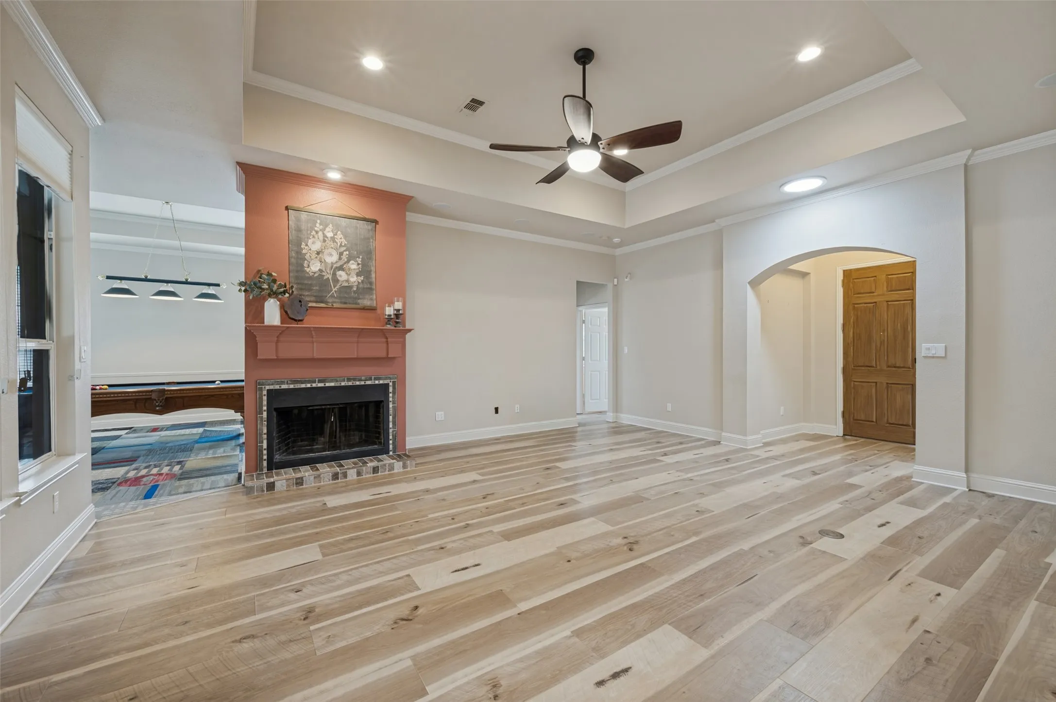 Living room is also semi open to the gameroom with pool table and ping pong cover and added space for card table