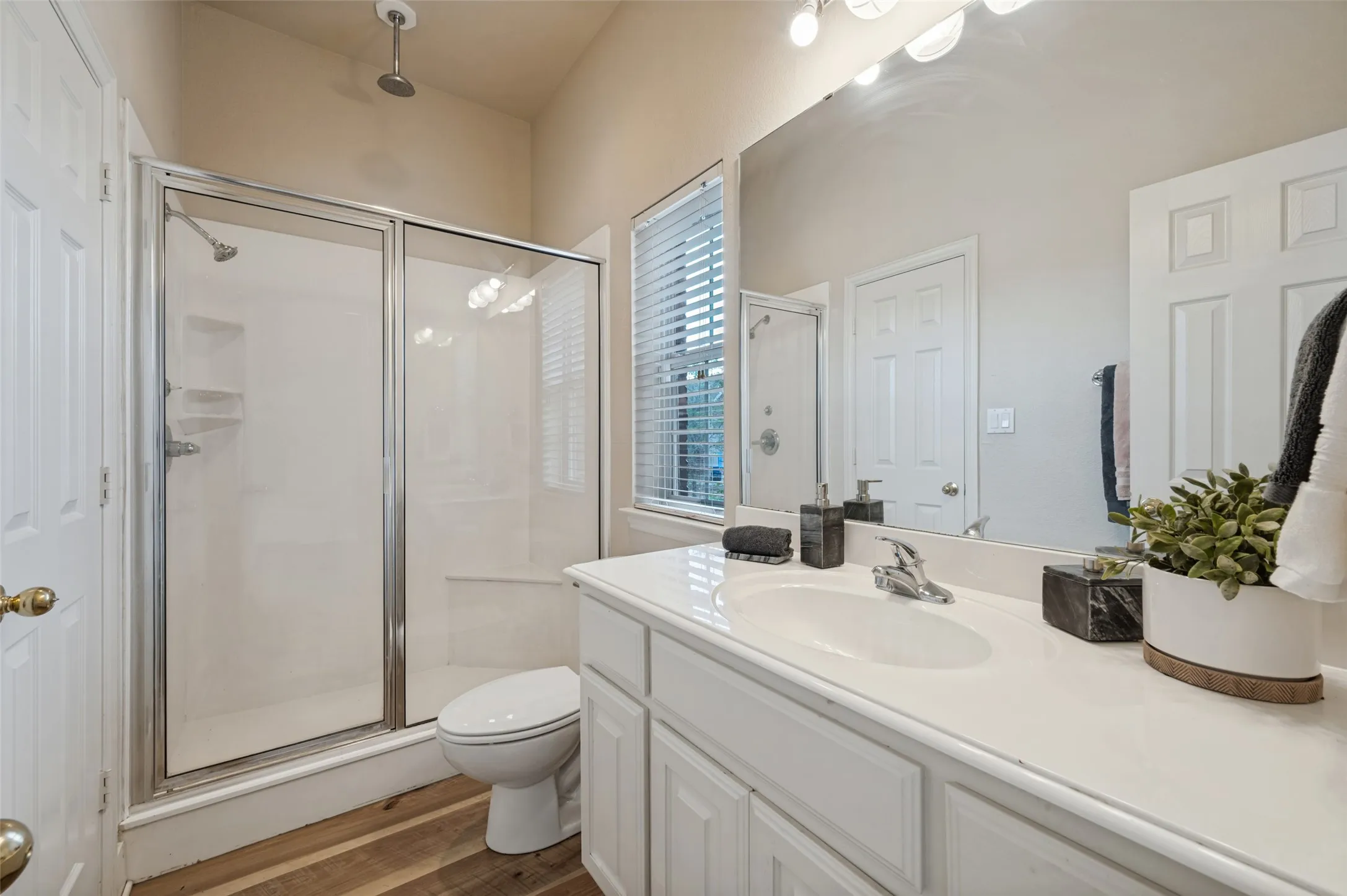 Jack and Jill bathroom between bedrooms #1 and #2 has an abundance of counter space and also features an overhead rain faucet feature!