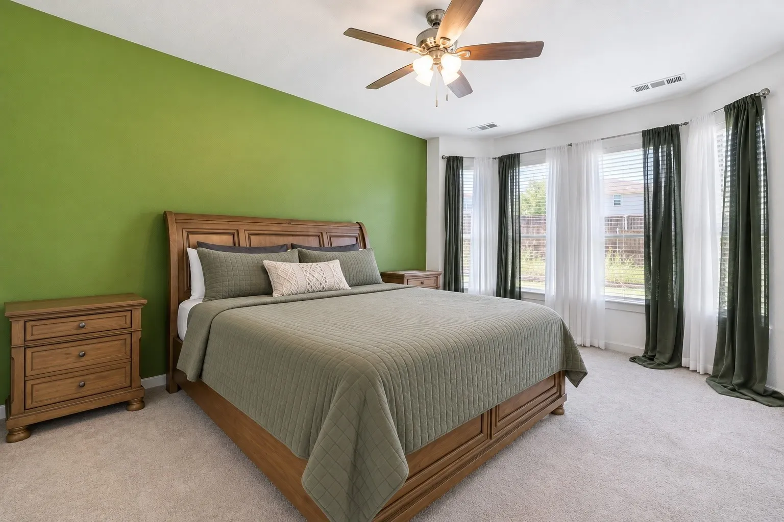 Recessed lighting, ceiling fan, and multiple windows with blinds