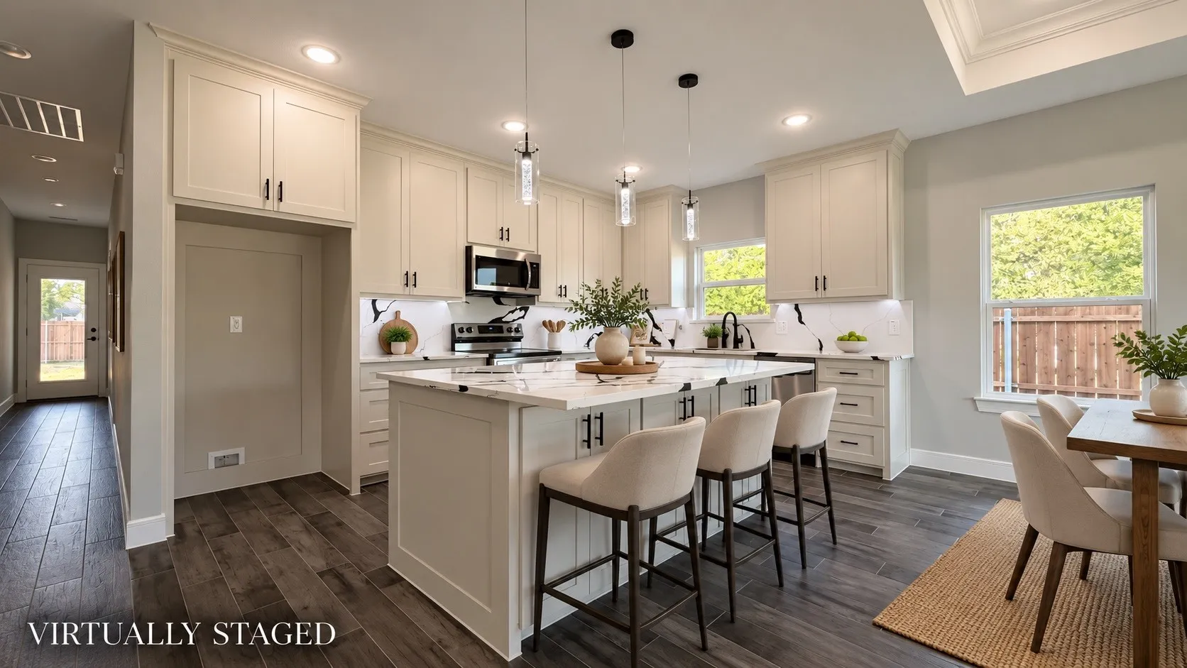 Modern kitchen featuring white shaker cabinetry, stainless steel appliances, a center island with seating, and wood-finish flooring