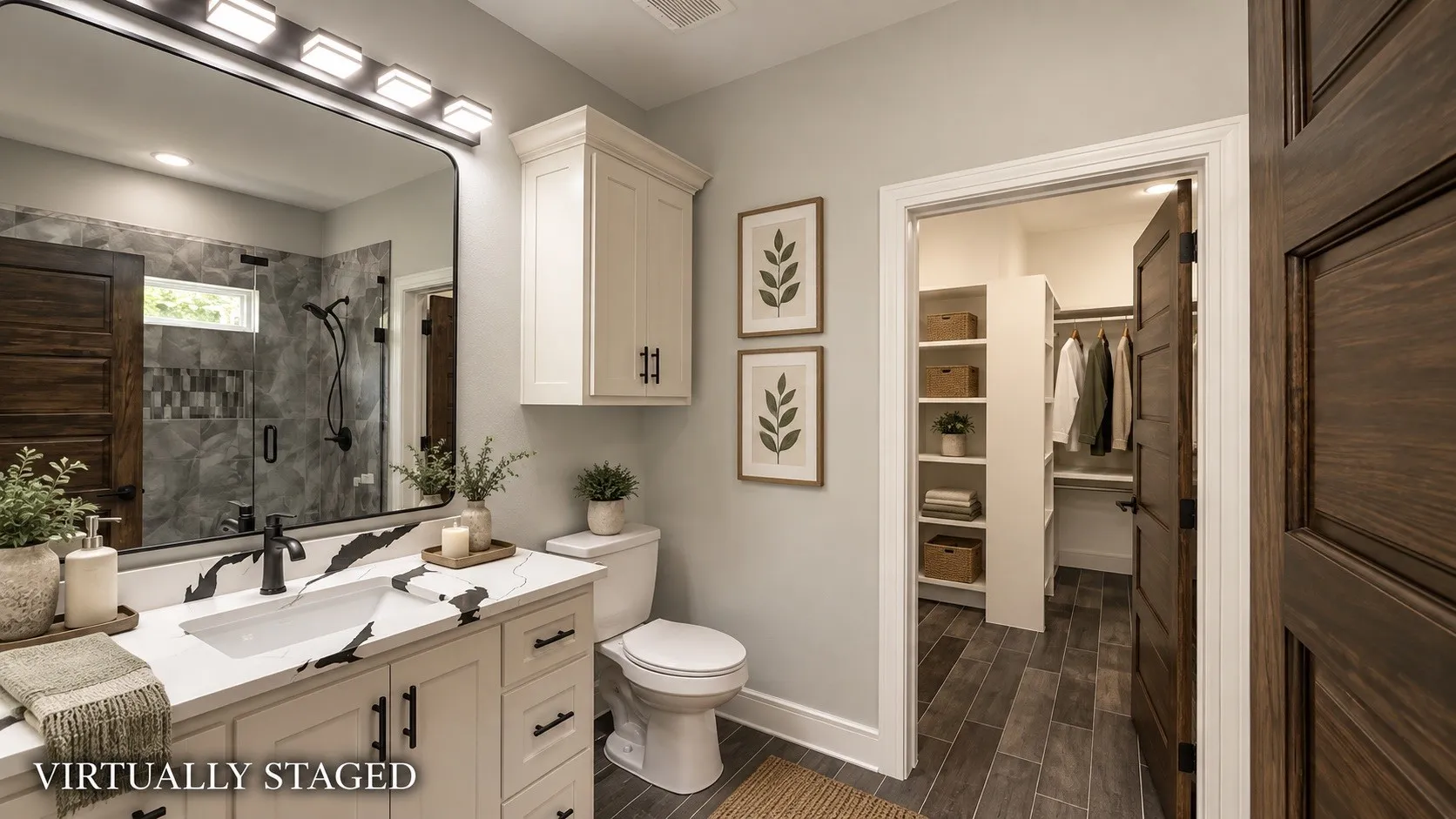 Bathroom featuring a vanity with a white countertop, dark wood-finish flooring, a glass-enclosed shower, and built-in closet shelving