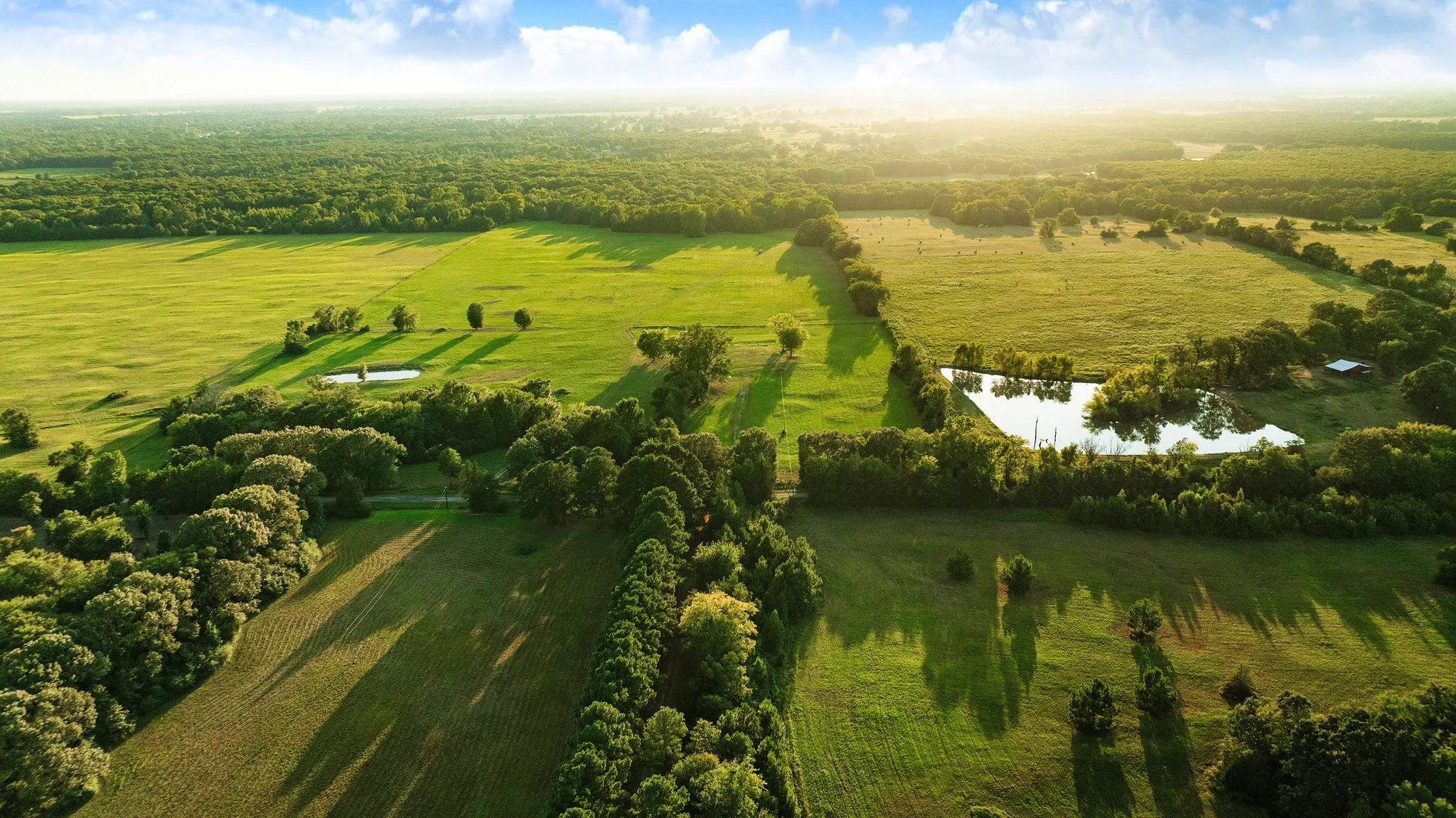 Aerial view showing the care of the land and of the other farm lands surrounding it.