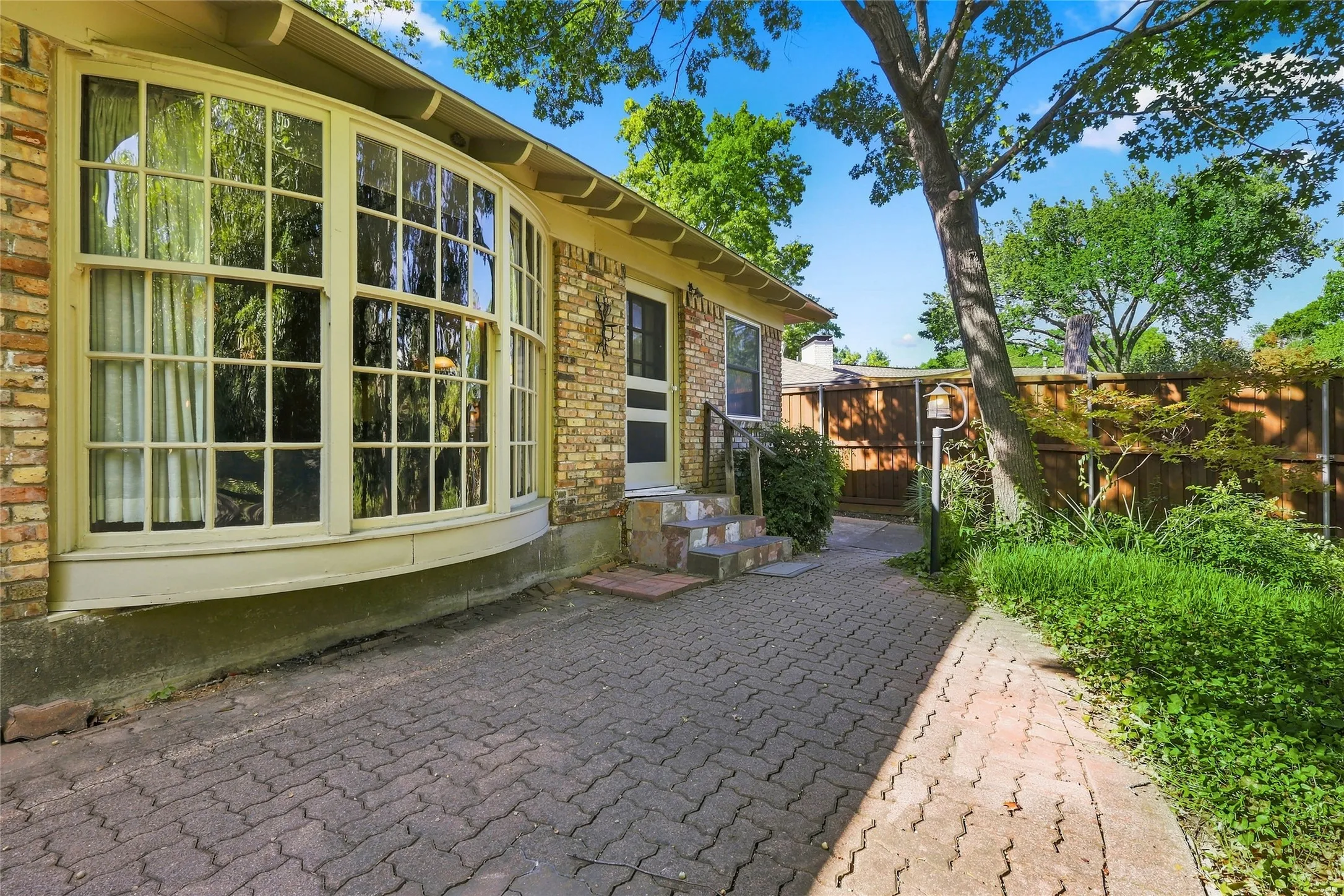 Want more Grass?  Simply Remove Pavers and Make the Yard Yours (There is a covered Porch by the Creek)